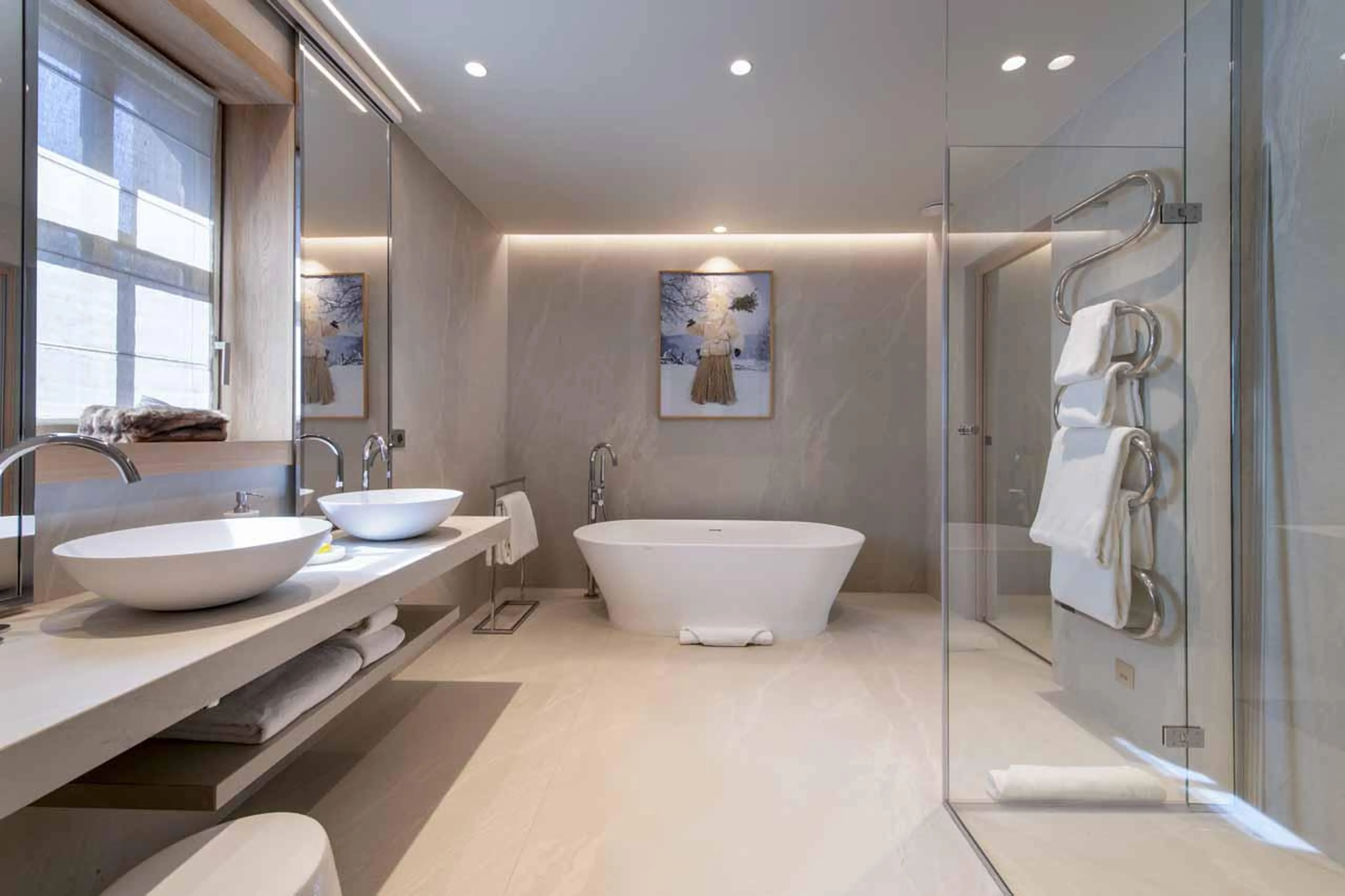En-suite bathroom with stand-alone bath and separate shower in Lord of Snow, Courchevel 1850