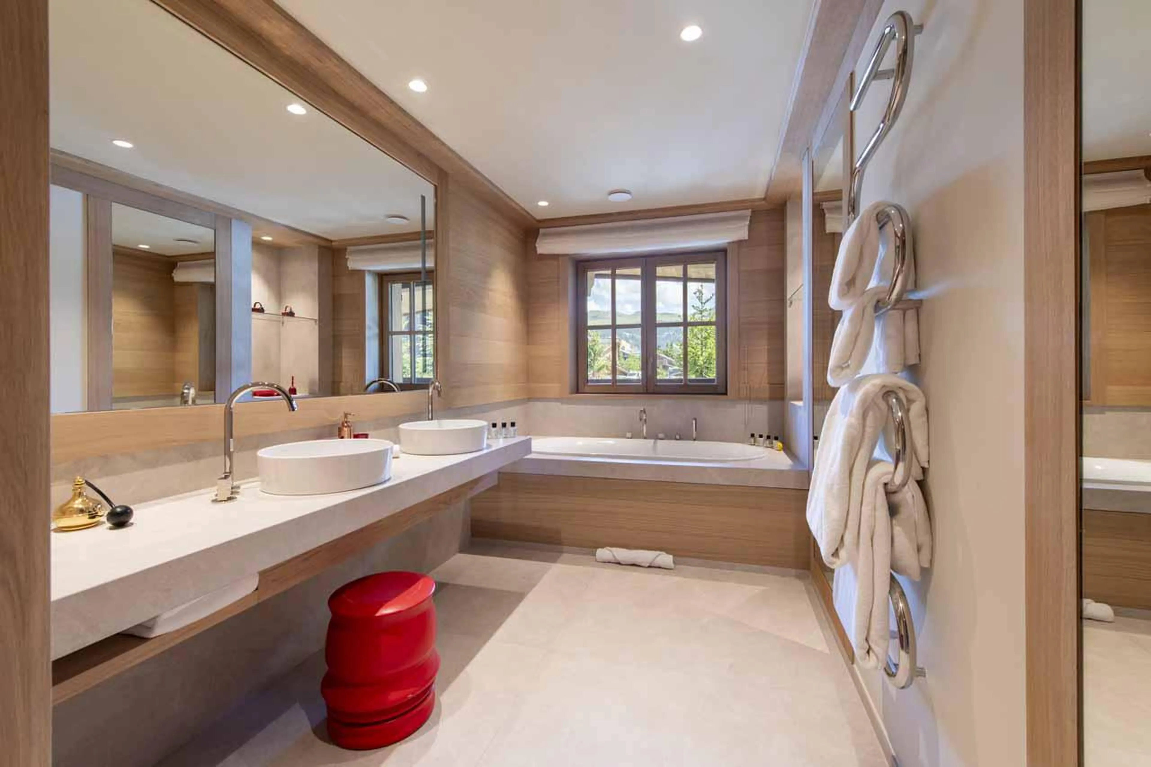 En-suite bathroom with separate shower and twin sinks in Lord of Snow, Courchevel 1850