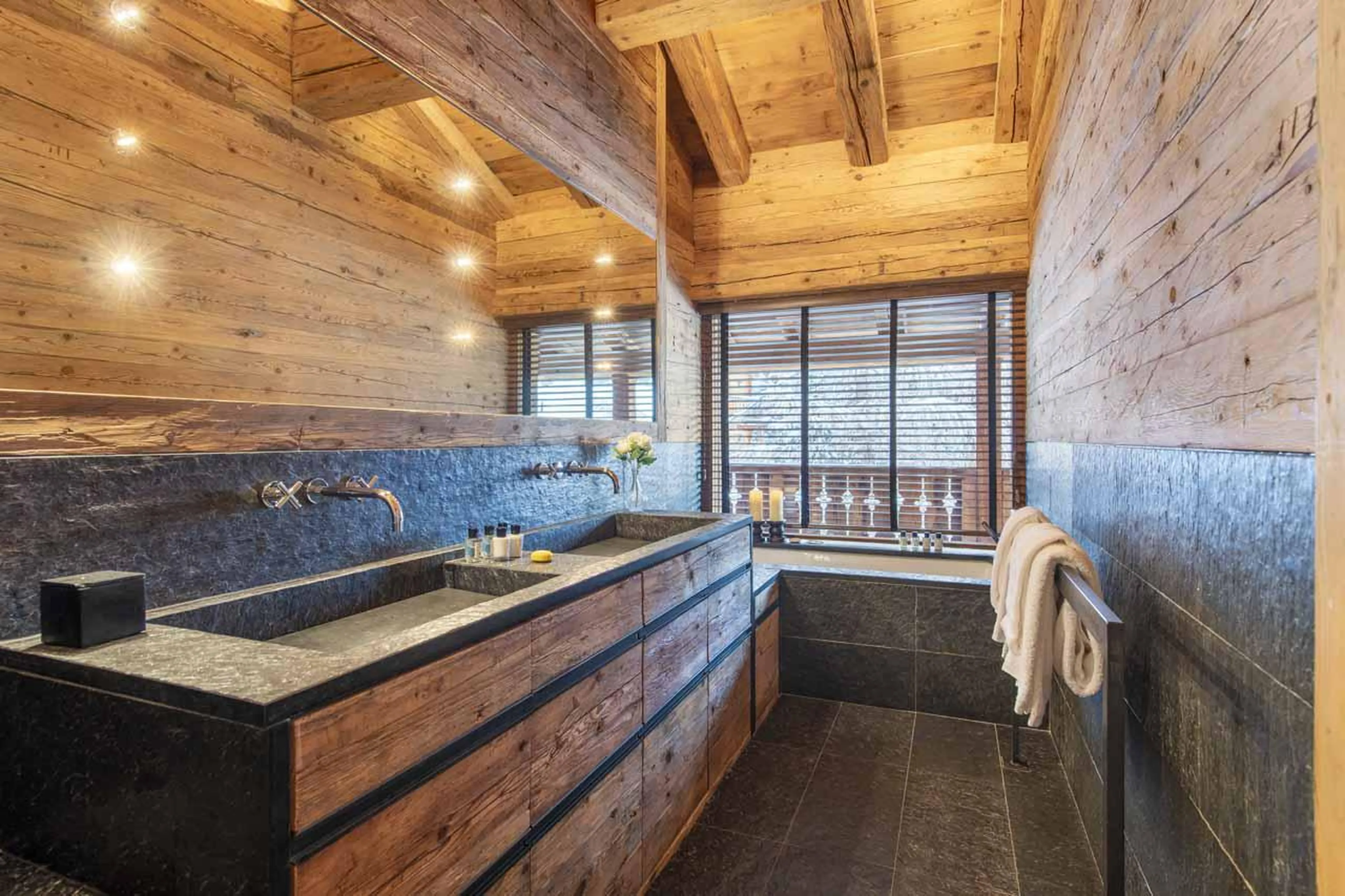 En-suite bathroom with bath at Marmotte Penthouse in Verbier
