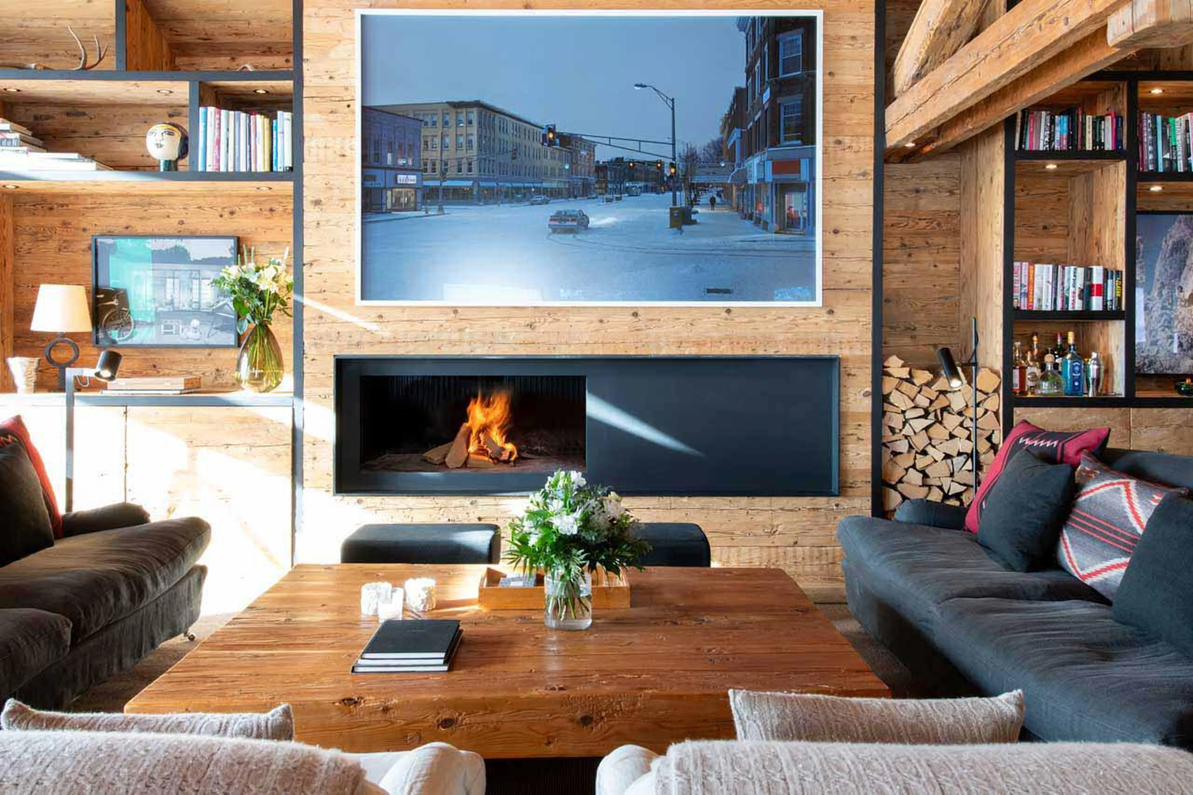 Elegant and sleek wood-burning fireplace at Marmotte Penthouse in Verbier