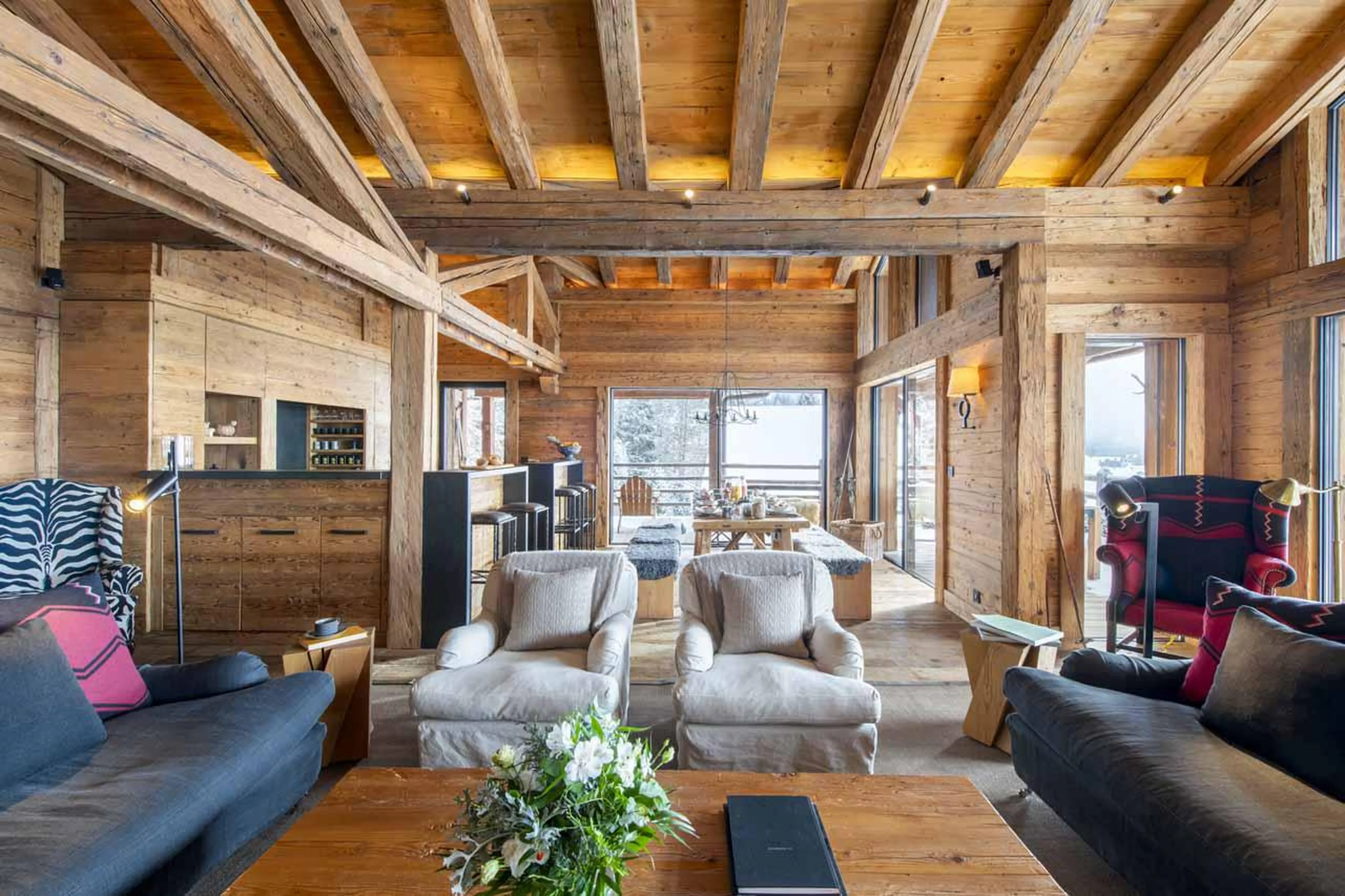 Living area with warm alpine charm at Marmotte Penthouse in Verbier