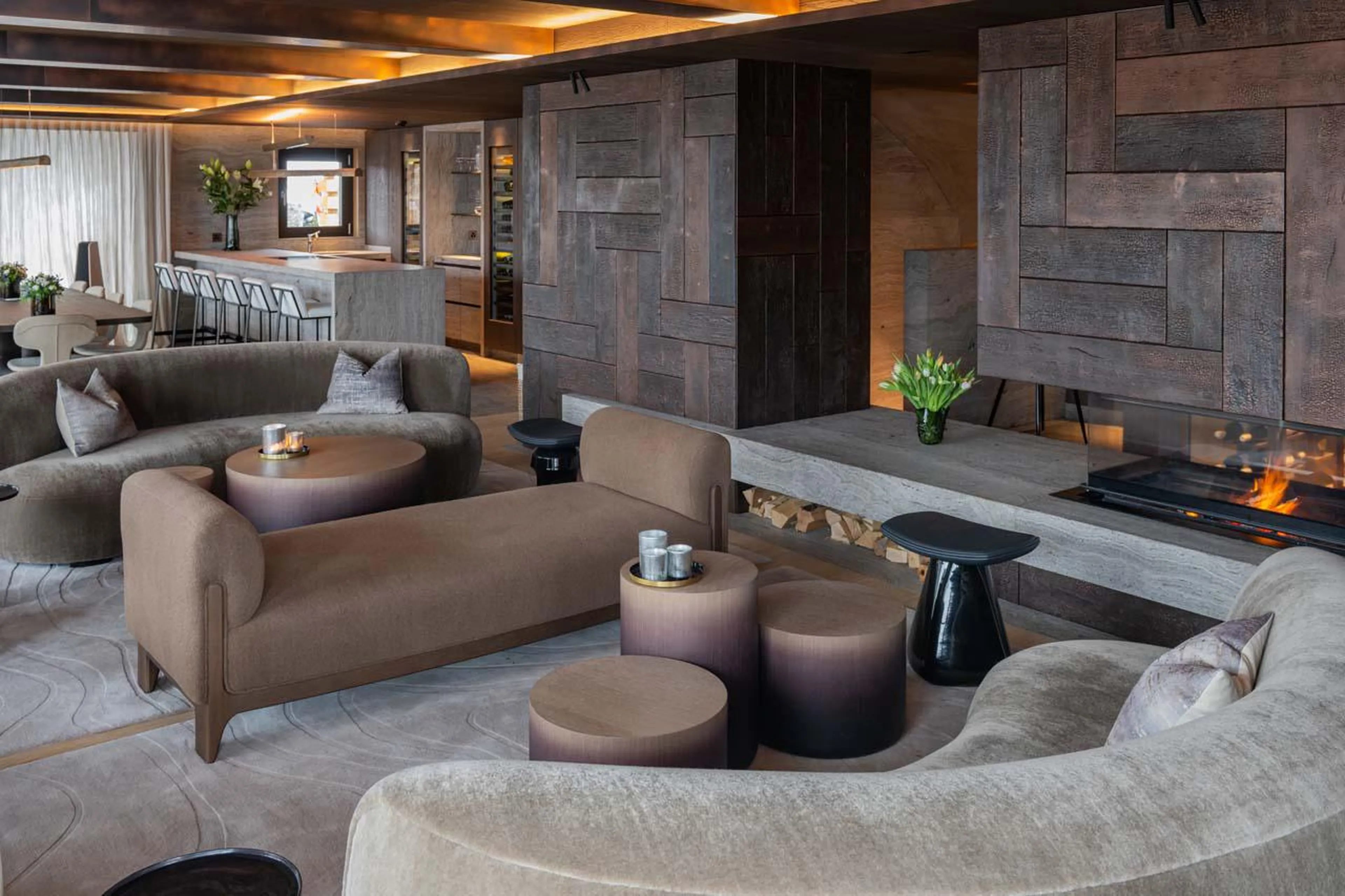 Sofa area with fireplace at Chalet No 14 in Verbier