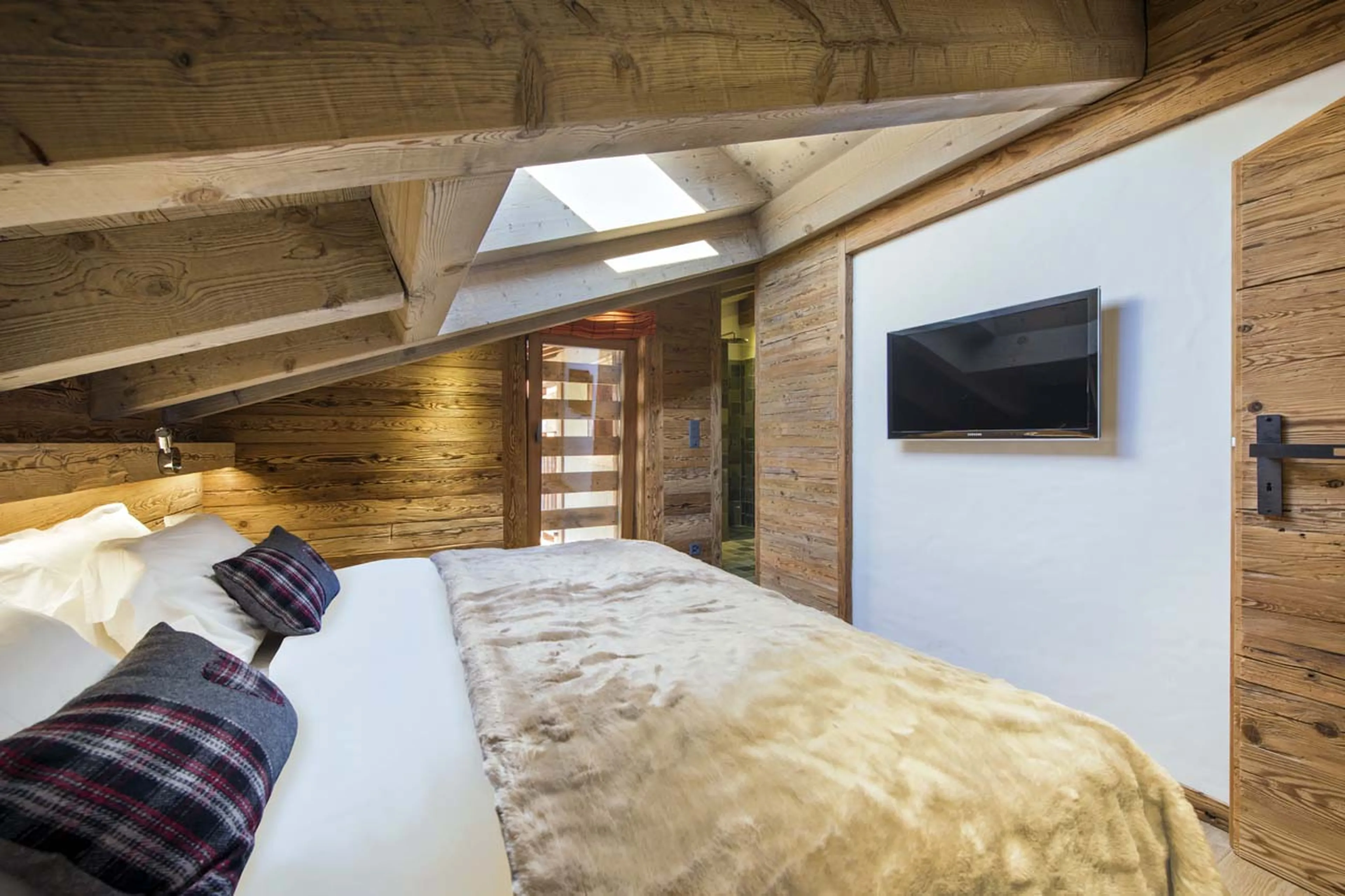 TV in bedroom two at No. 5 Penthouse in Verbier