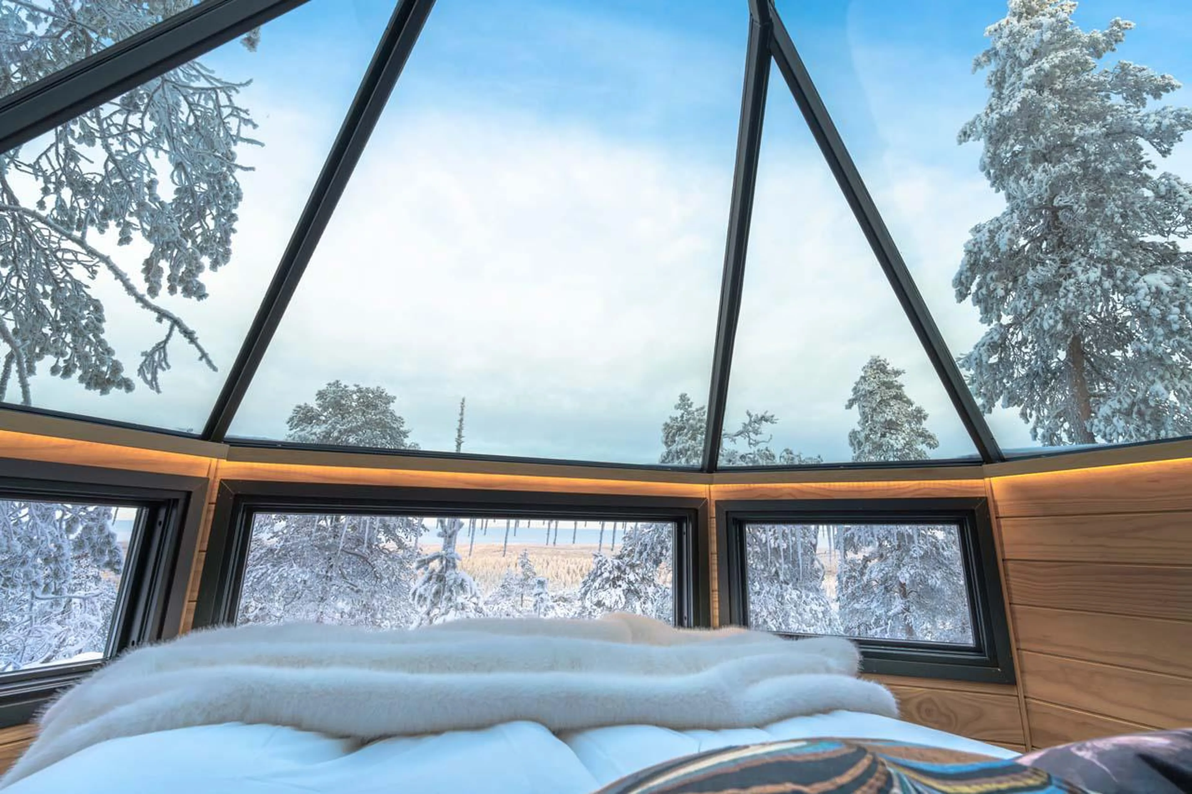 Stunning views from the double bed at Octola Glass Igloo in Finland