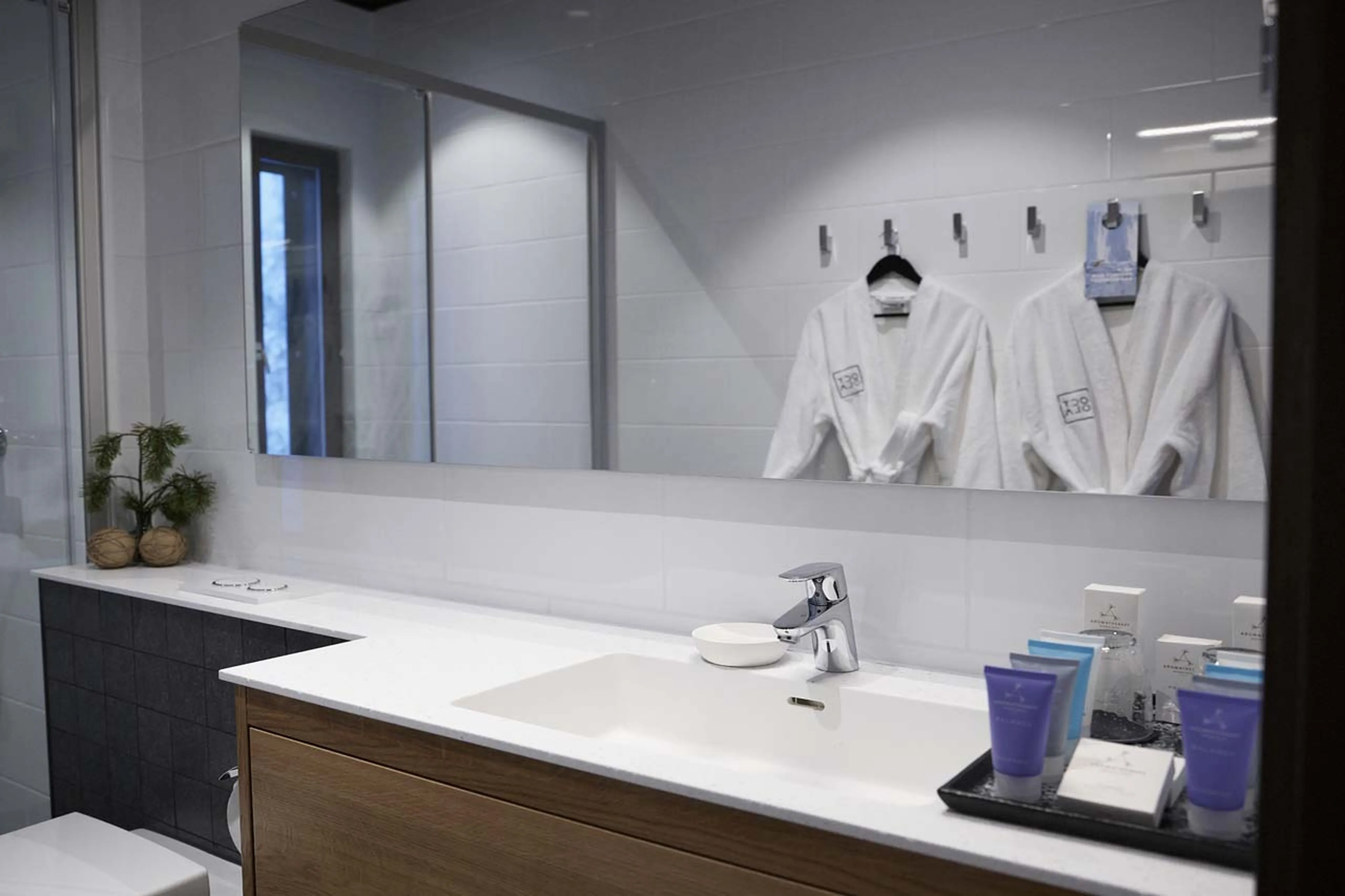 Robes in bathroom at Octola Private Wilderness in Finland