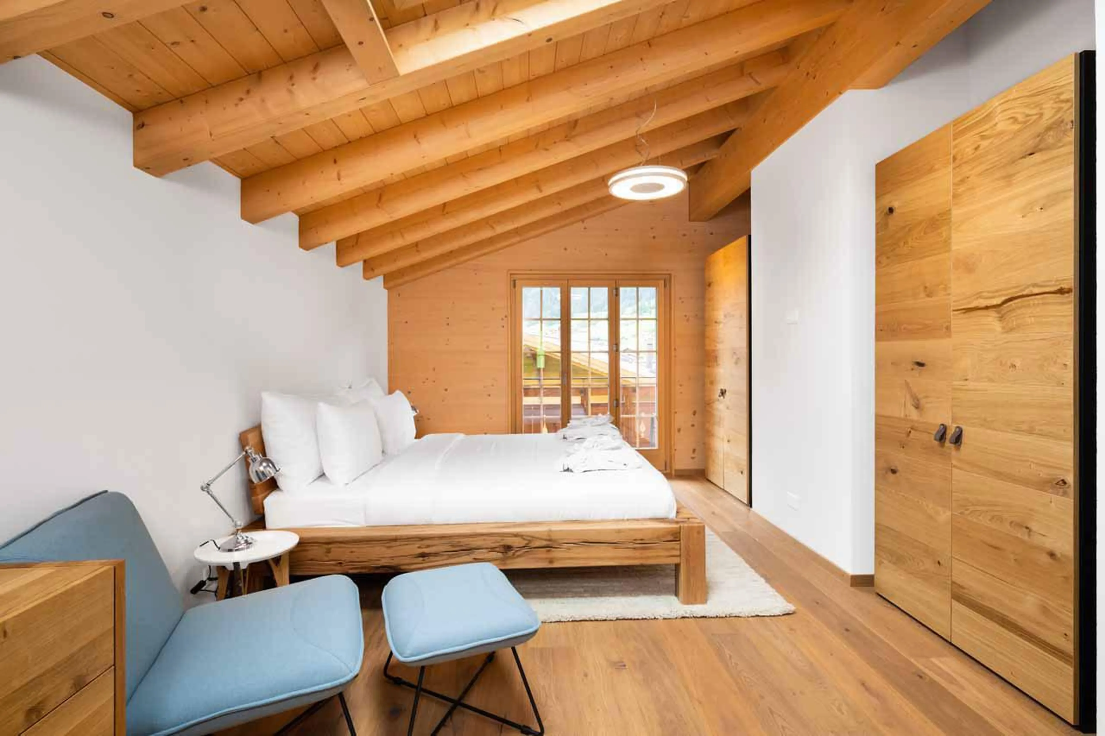Large double bedroom with skylight at Chalet Alia in Grindelwald