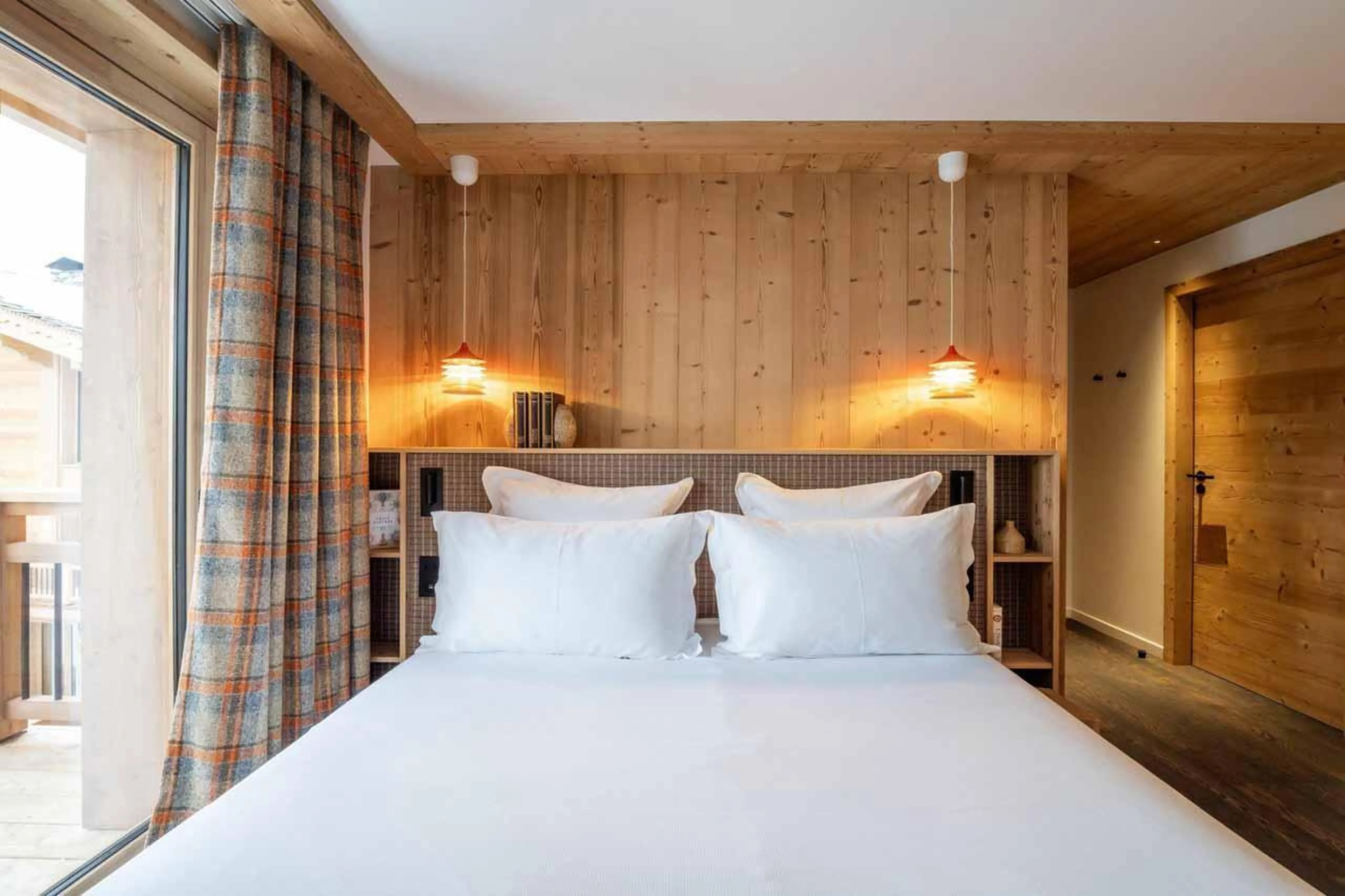 Double bedroom with glass door in Chalet Beloukha, Courchevel Le Praz