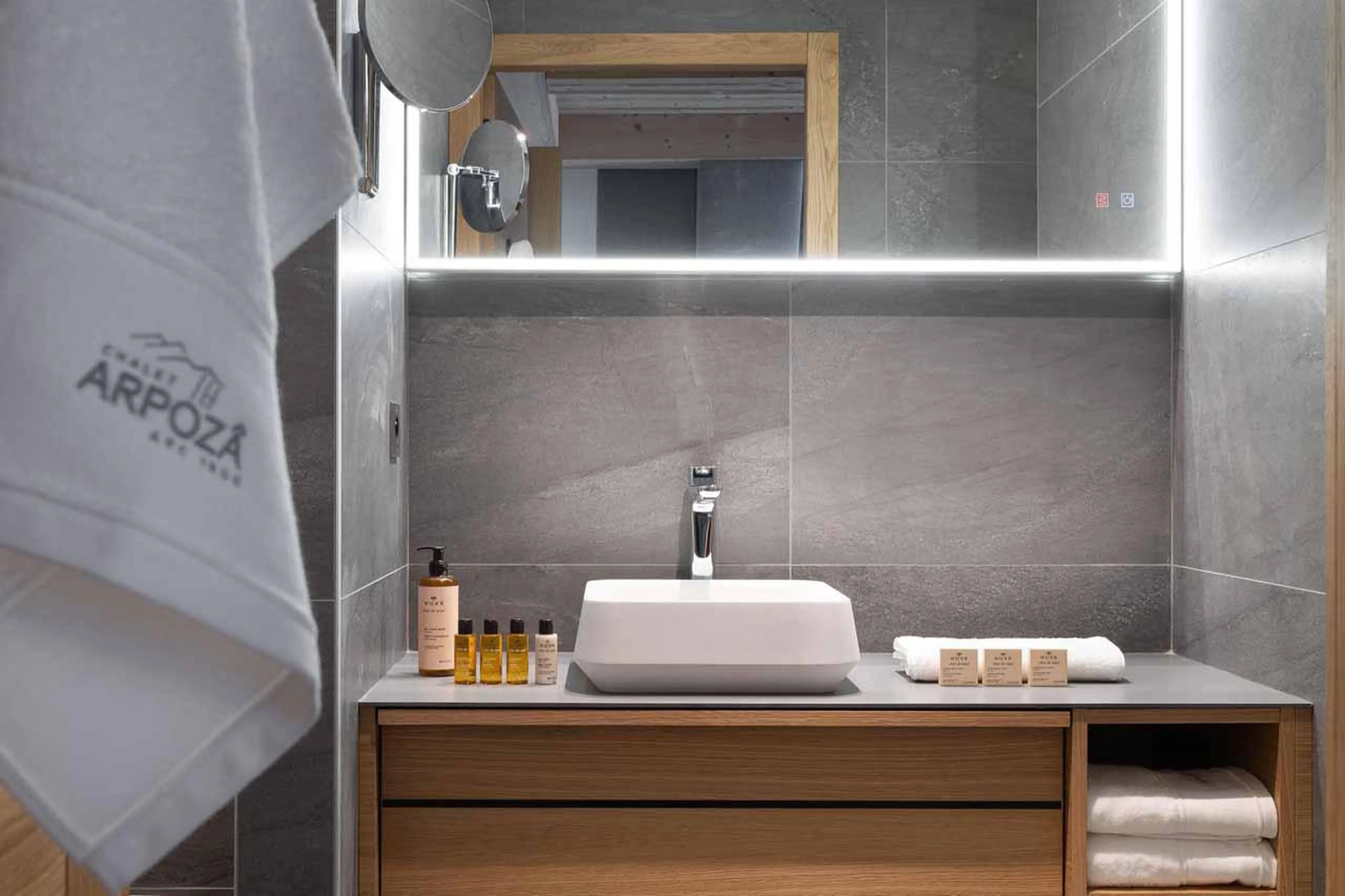 En-suite shower room with integrated sound system at Chalet Arpoza in Les Arcs