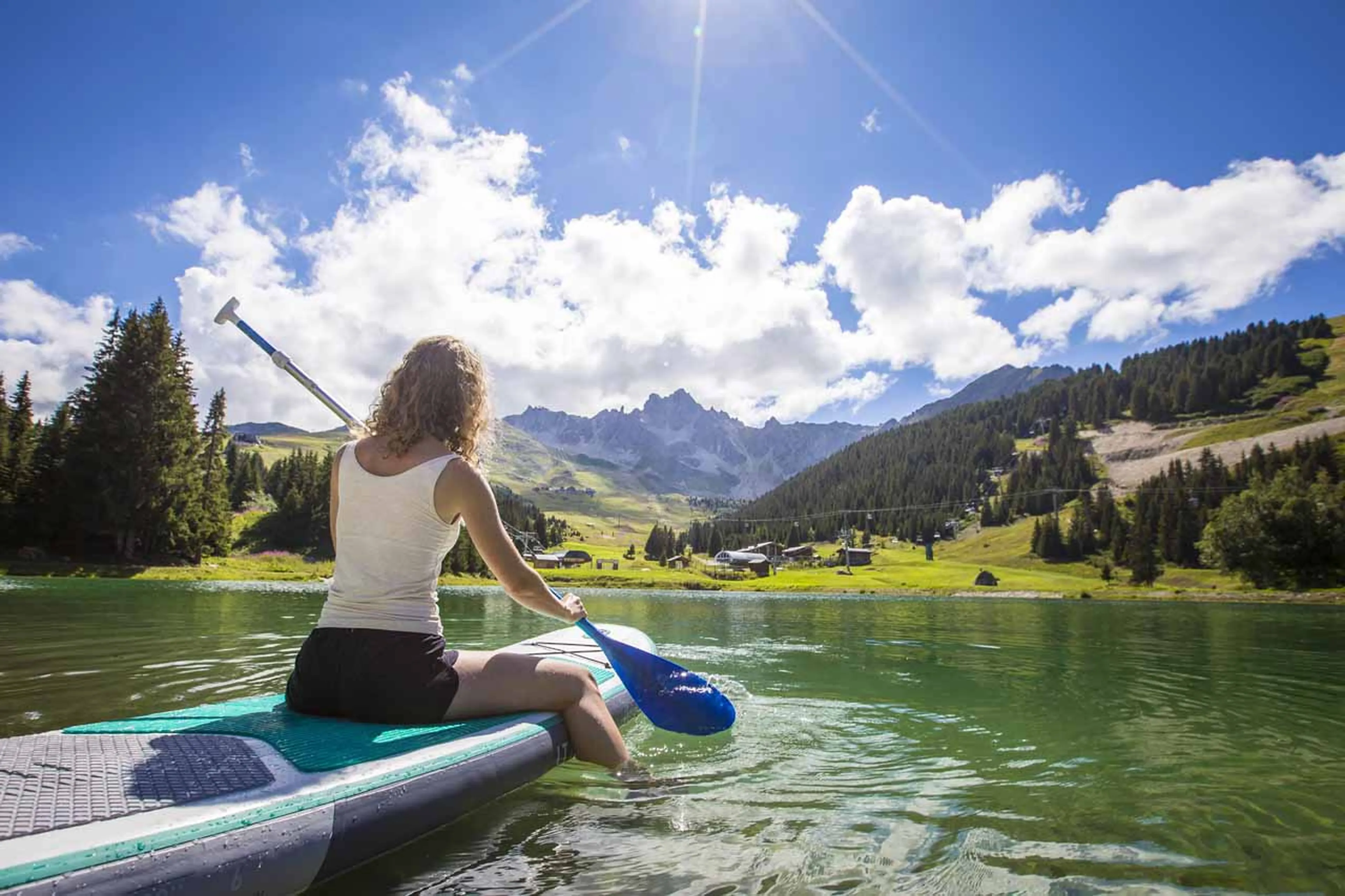 Paddle boarding in summer in Courchevel
