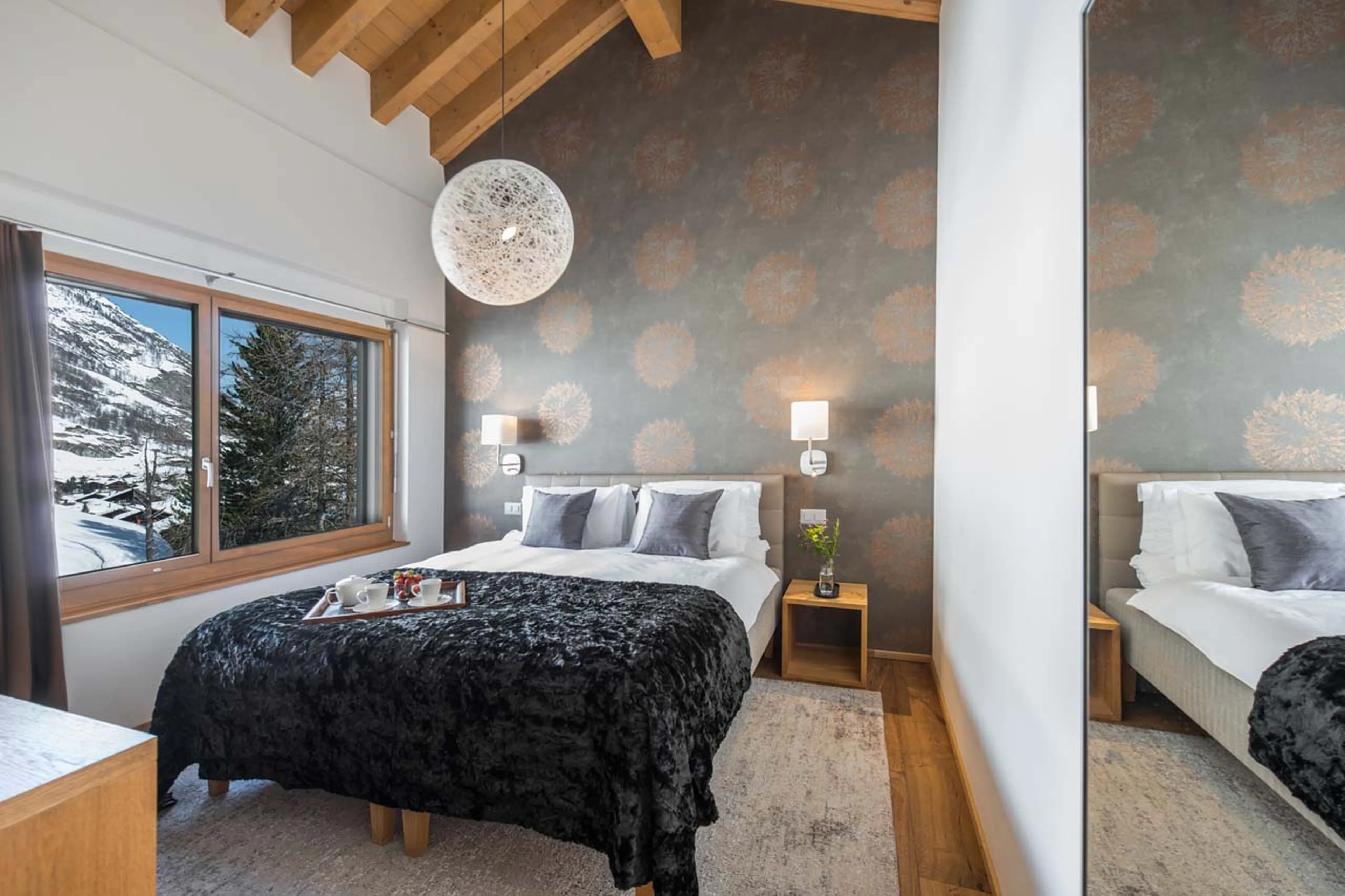 Mountain views from bedroom one at Penthouse Aria in Zermatt