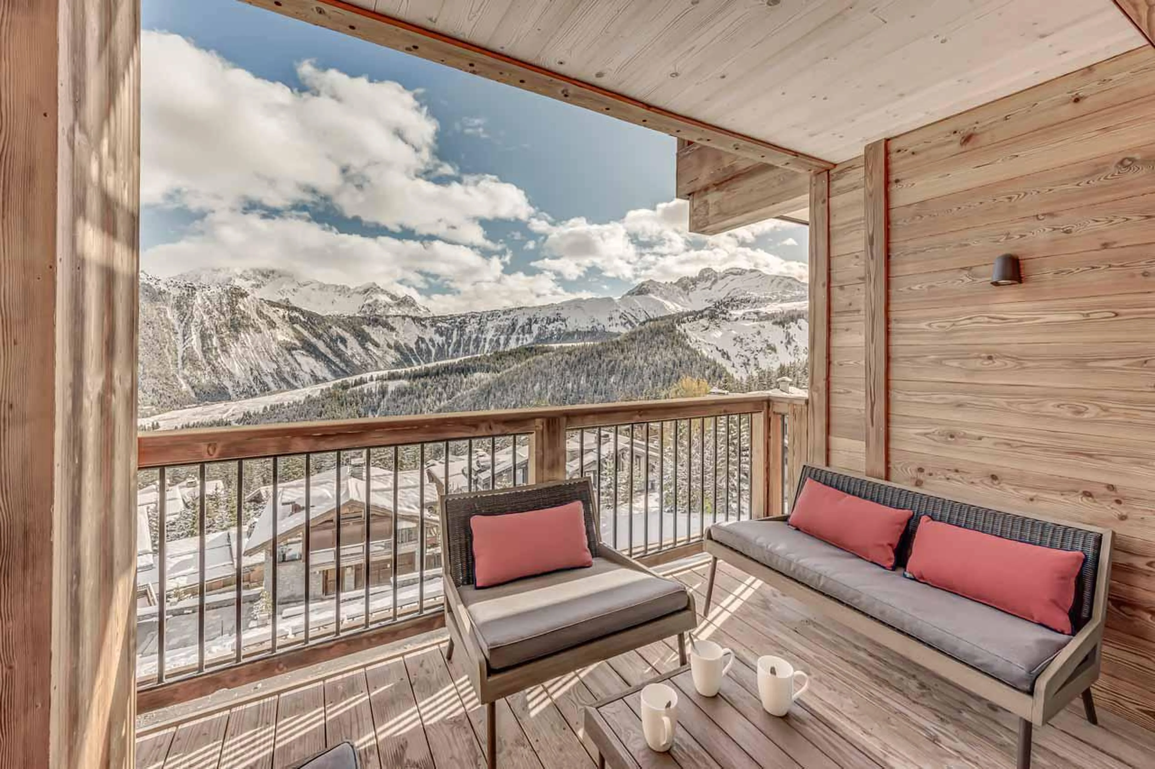 Balcony with picturesque views leading from living space at Penthouse B in Courchevel 1850