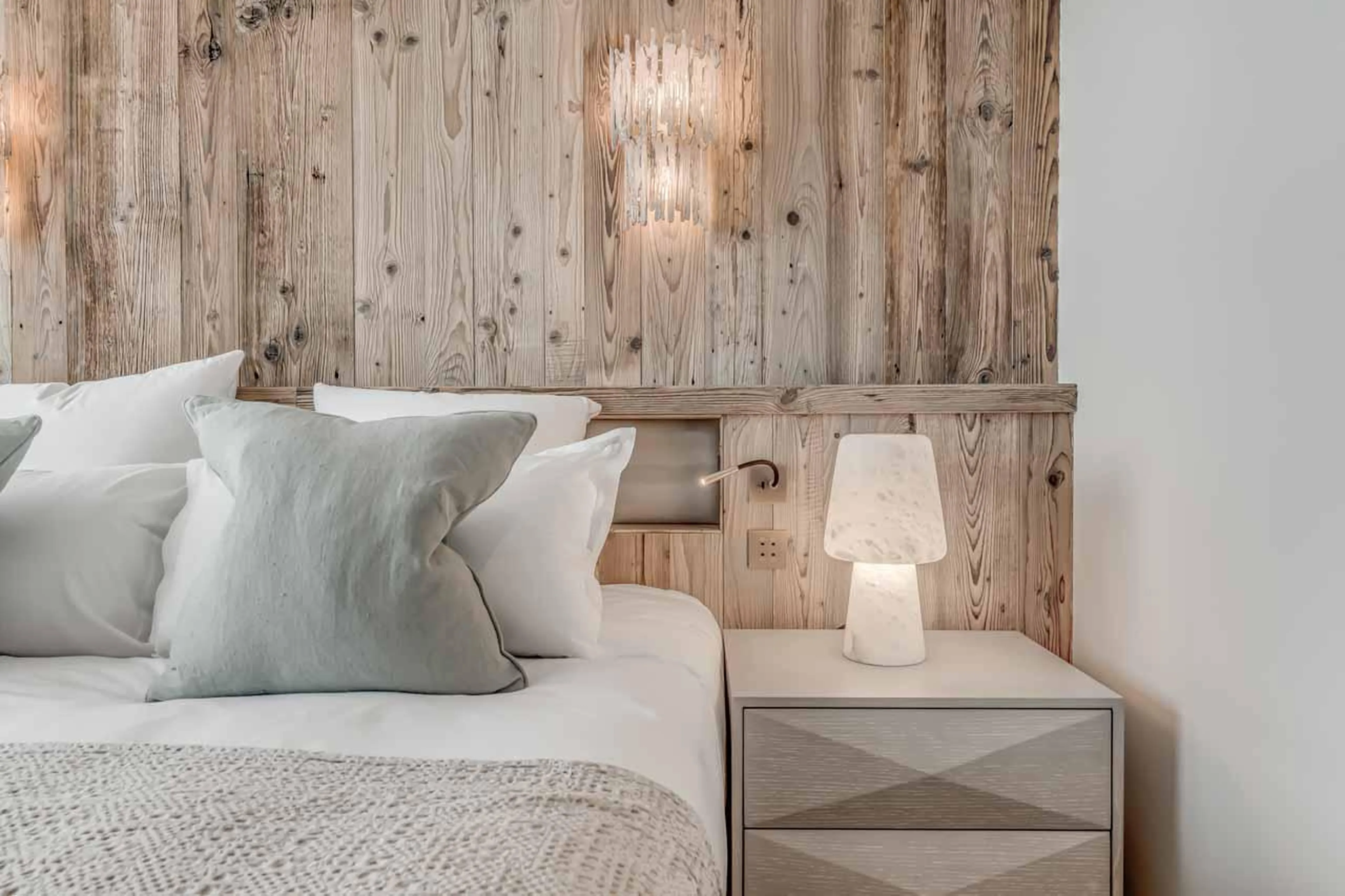 Bedroom featuring natural wood furnishings at Penthouse B in Courchevel 1850