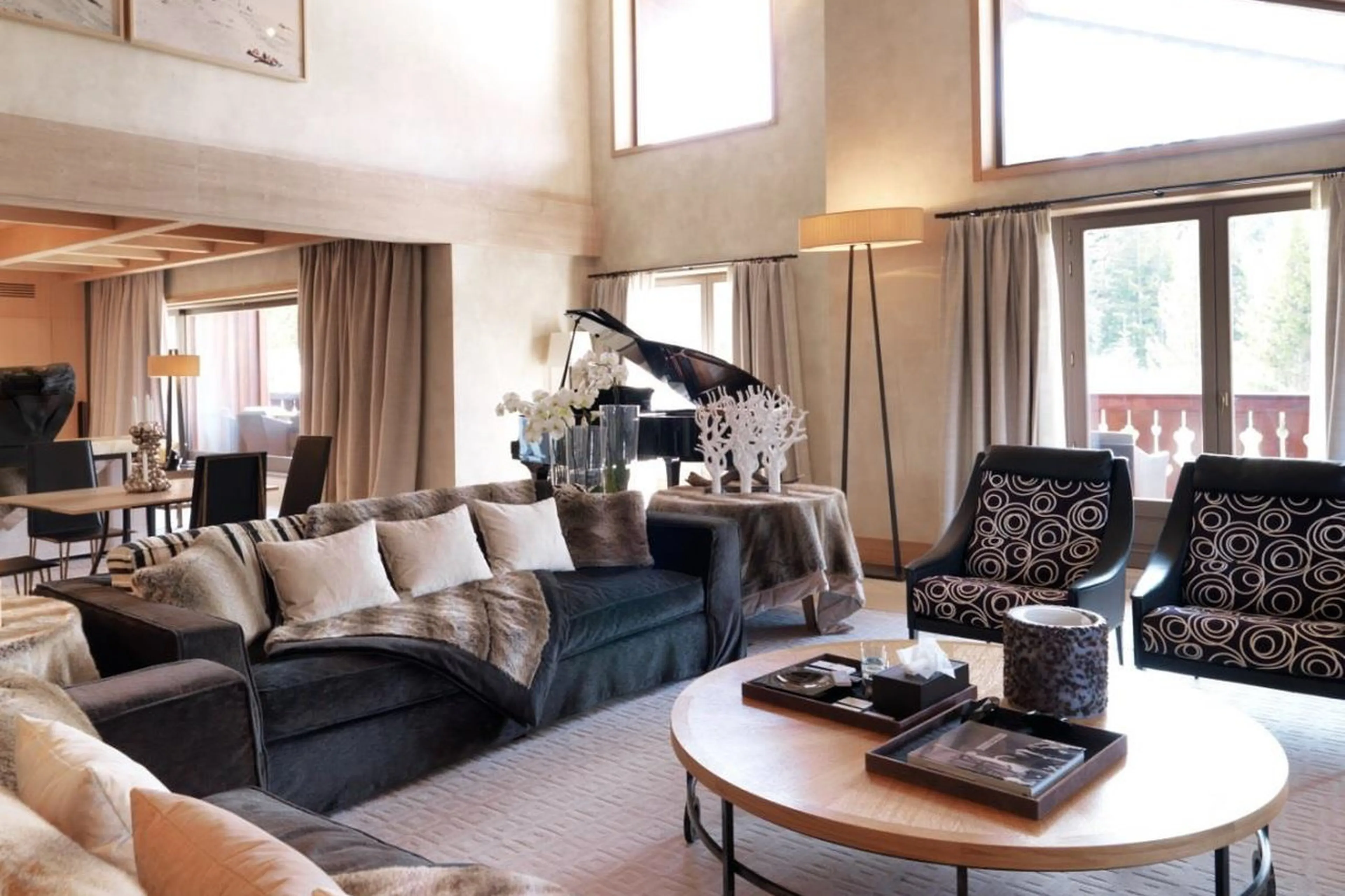One of the succession of lounges with grand piano in Penthouse Cheval Blanc in Courchevel 1850
