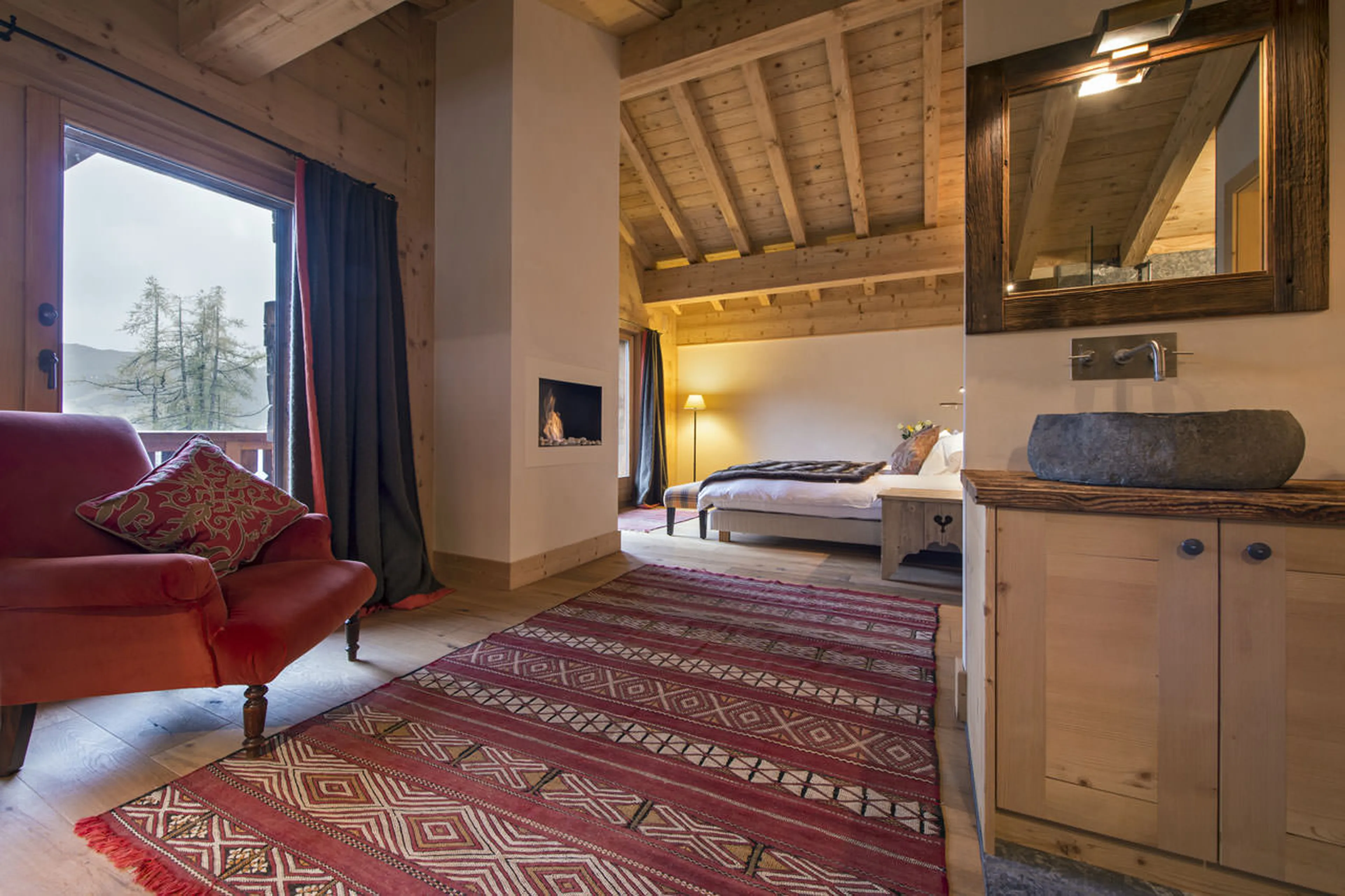 Fireplace in master suite at Penthouse Deux Riviers in Verbier