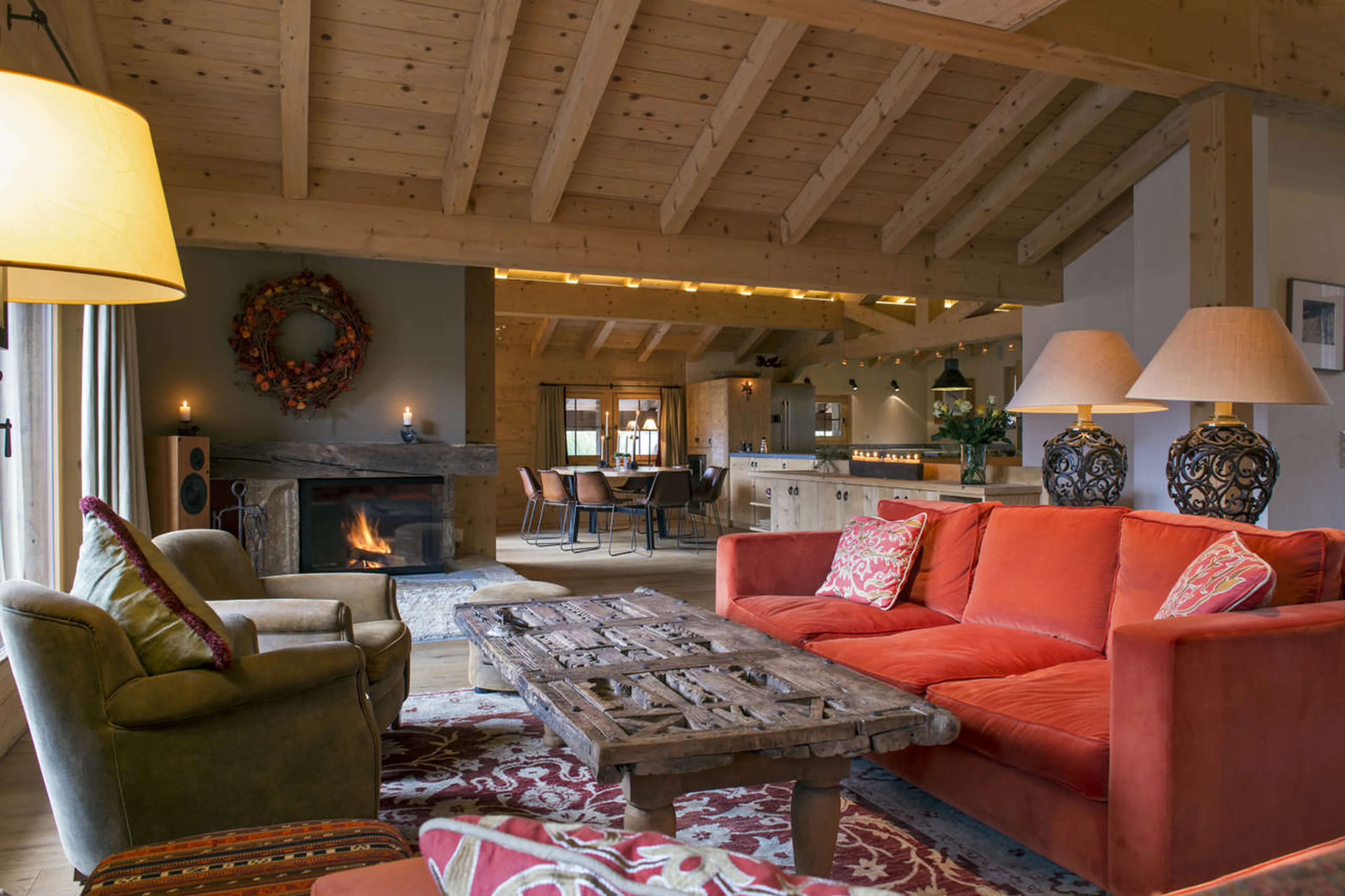 Stone fireplace in living room of Penthouse Deux Riviers in Verbier
