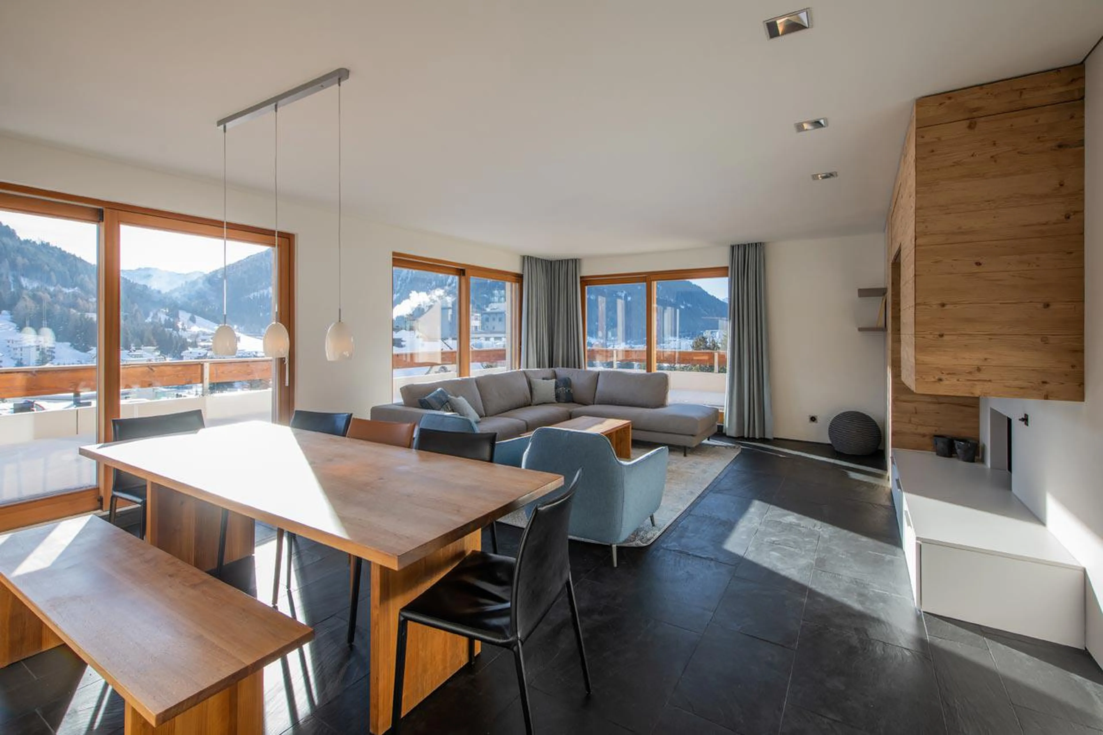 Living and dining area with terrace access in Apartment Flora 4S in Davos