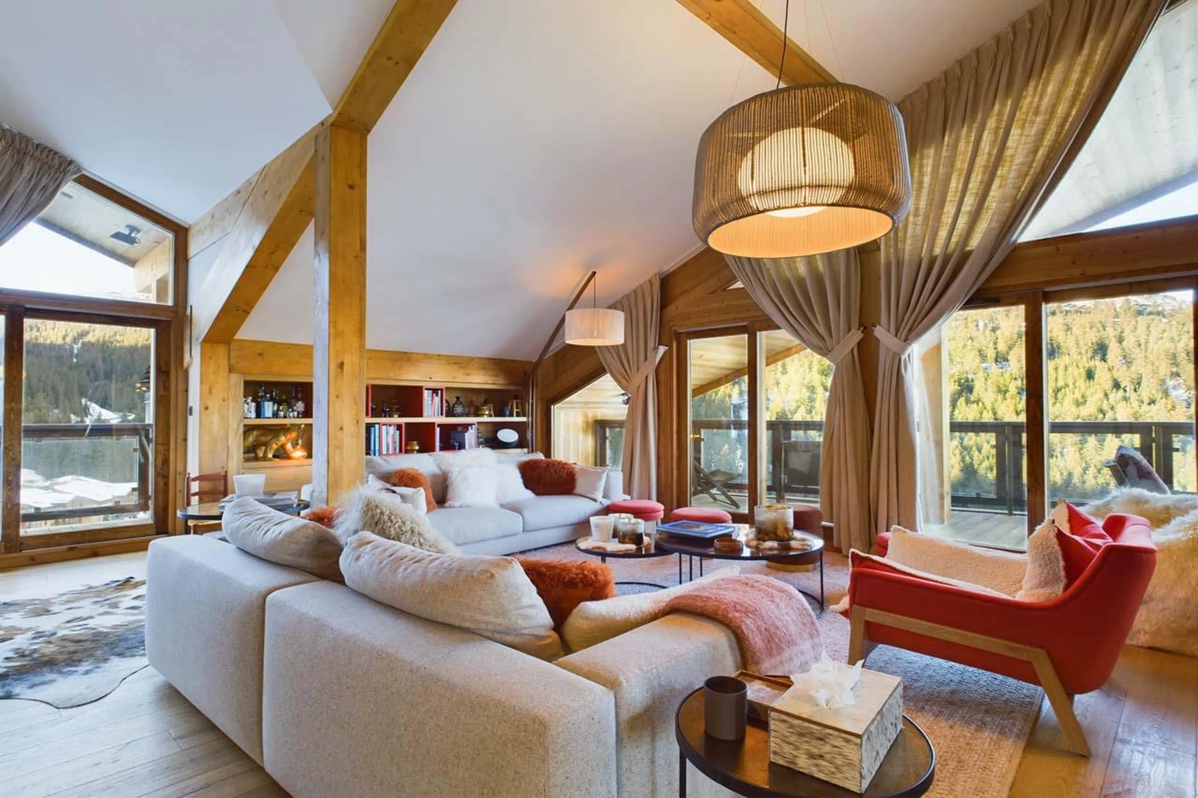Open-plan living area with access to broad balcony at Penthouse Le Belladone in Courchevel 1650