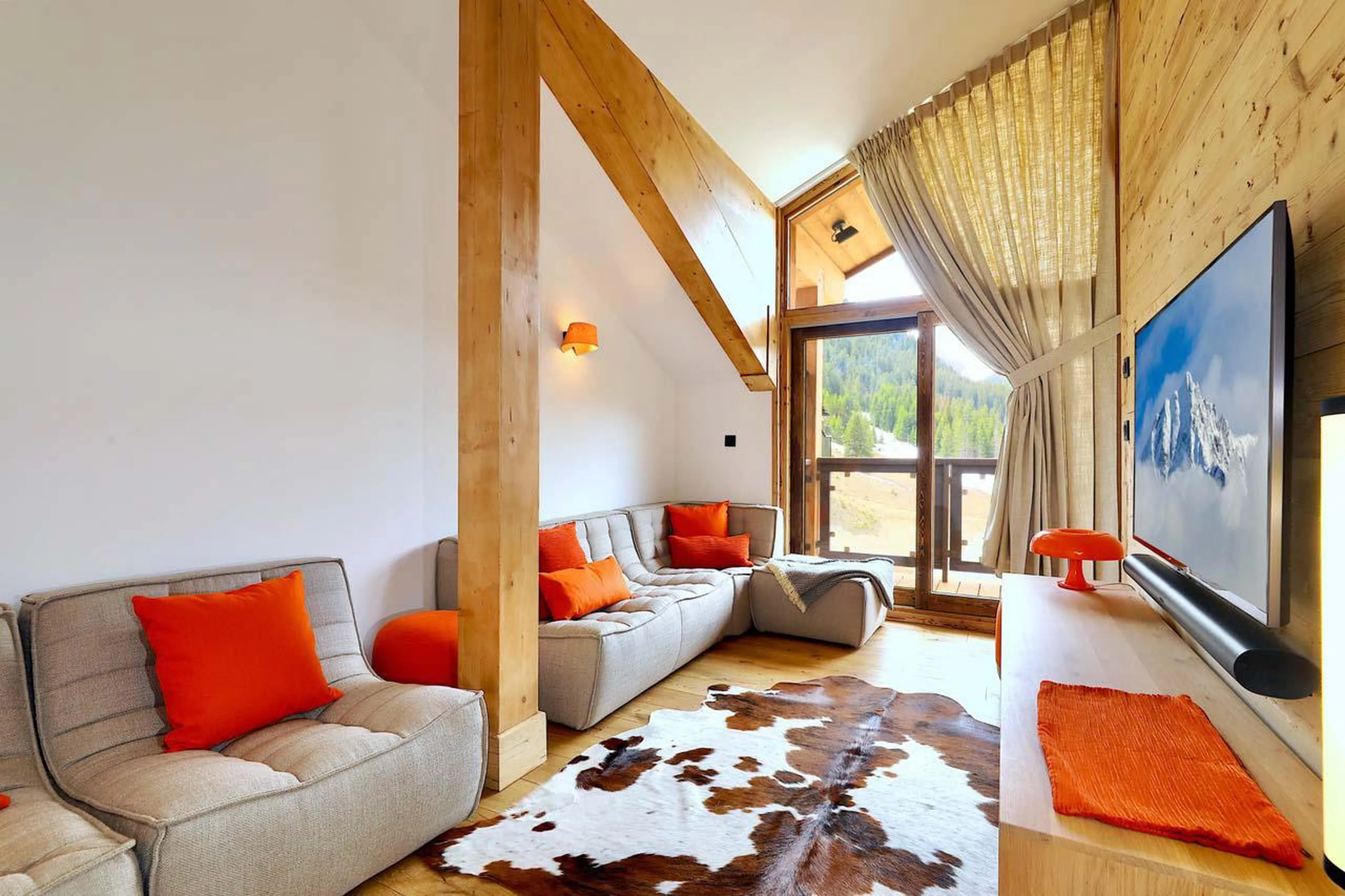 TV corner with sofas and flat screen TV at Penthouse Le Belladone in Courchevel 1650