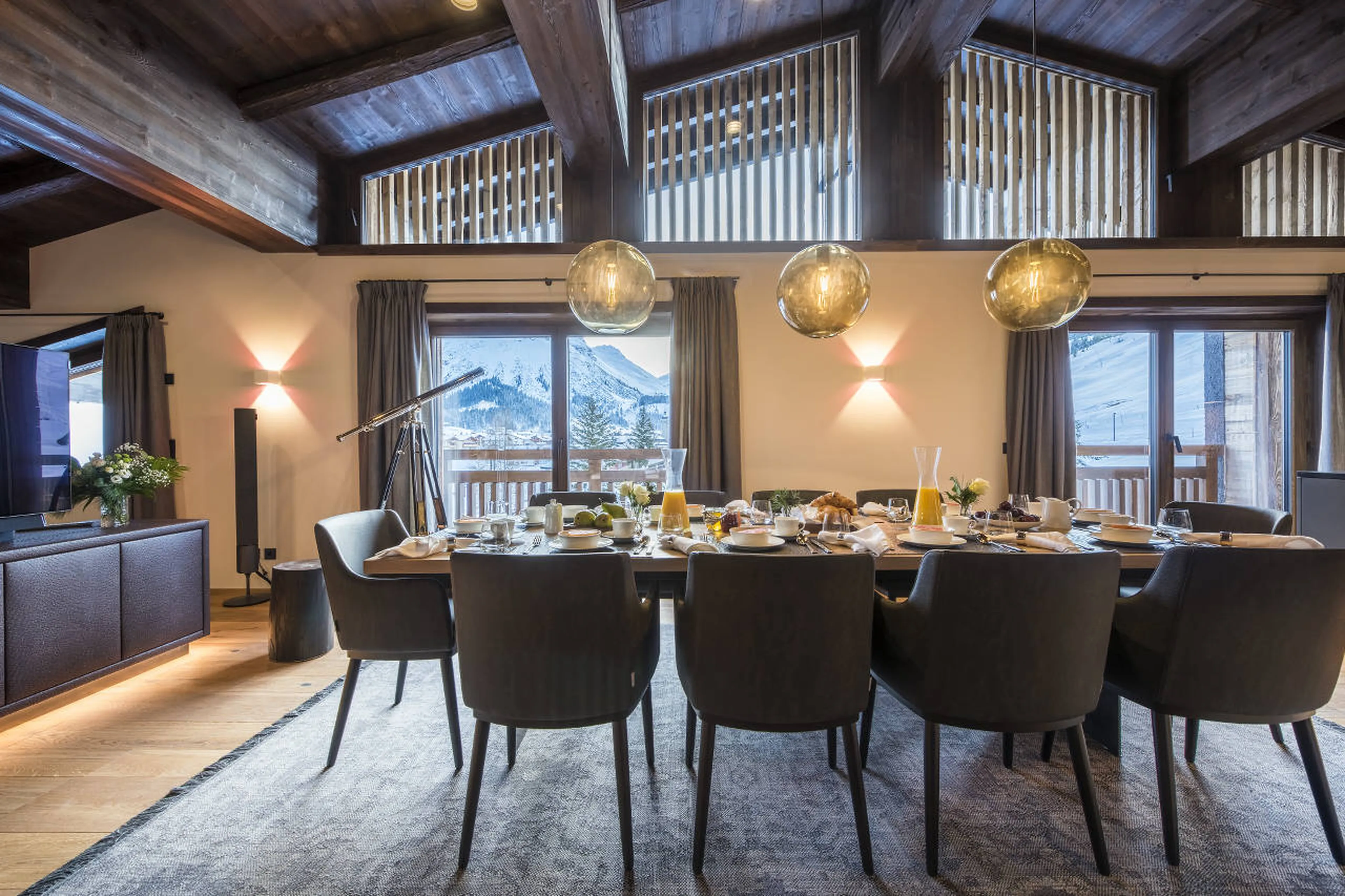 Floor to ceiling windows and doors bring view inside Nidus Penthouse in Lech