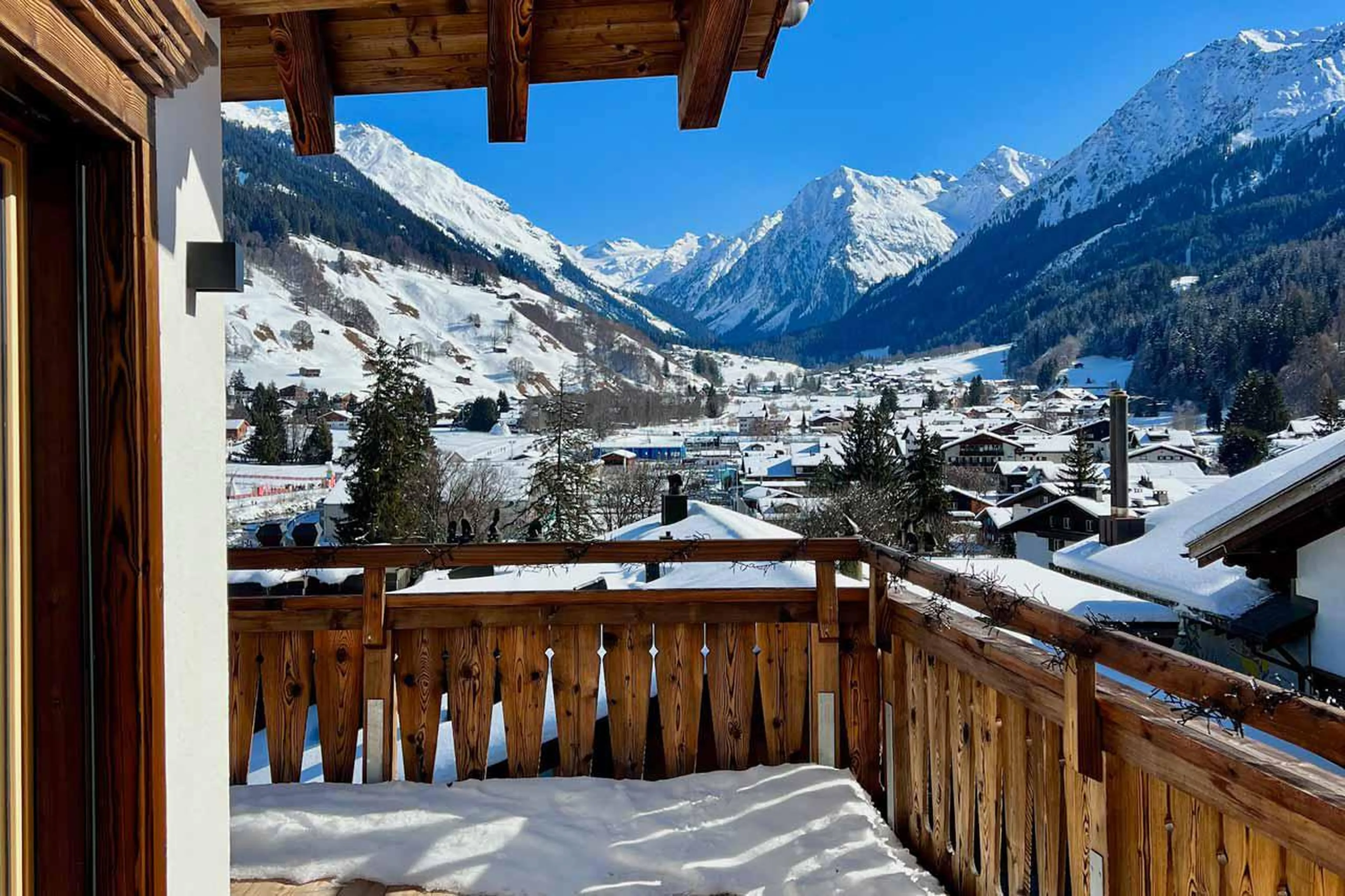 Balcony views in snow at Penthouse Silvretta in Klosters