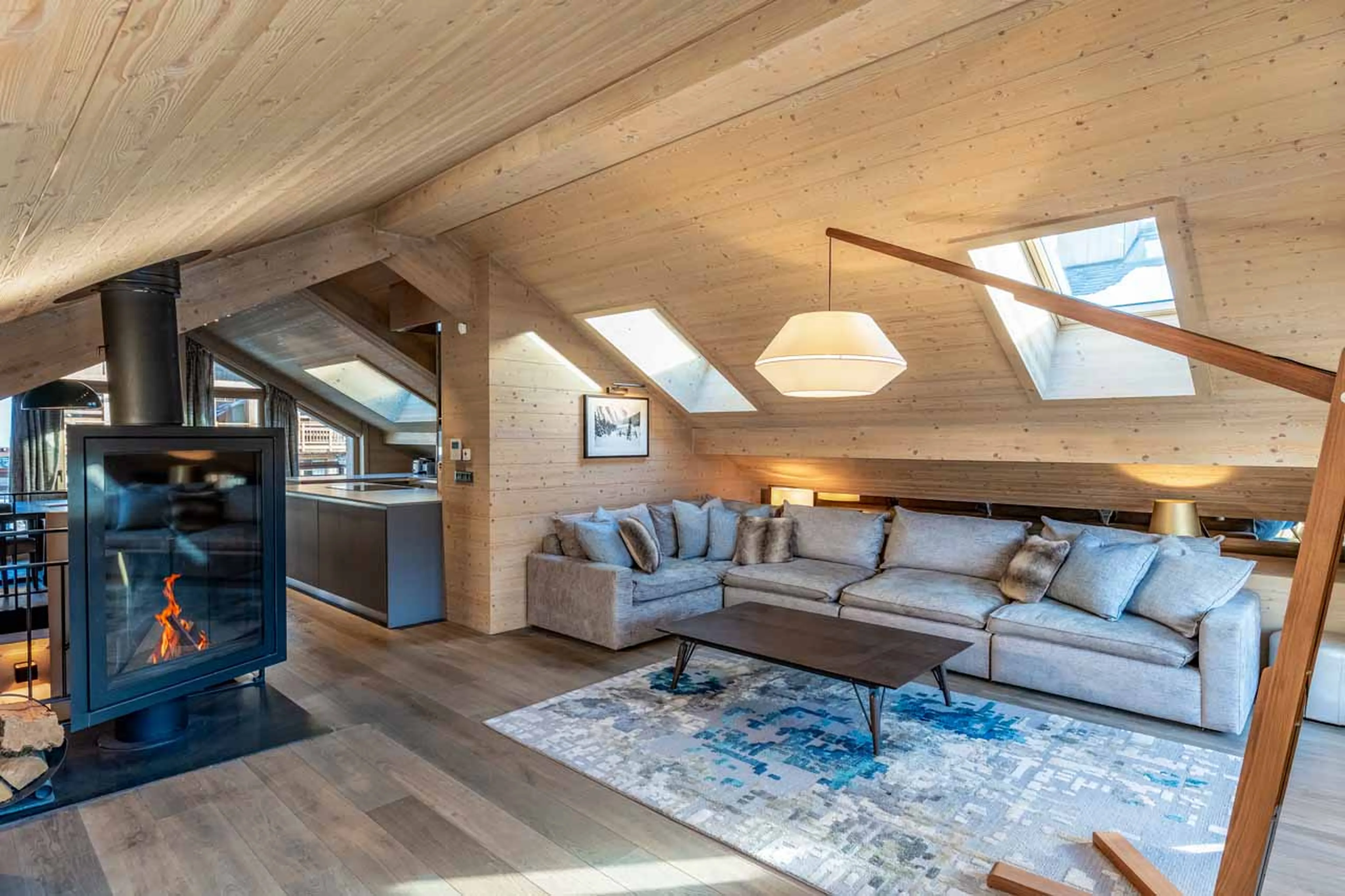 Living area fireplace at Penthouse Tueda in Meribel