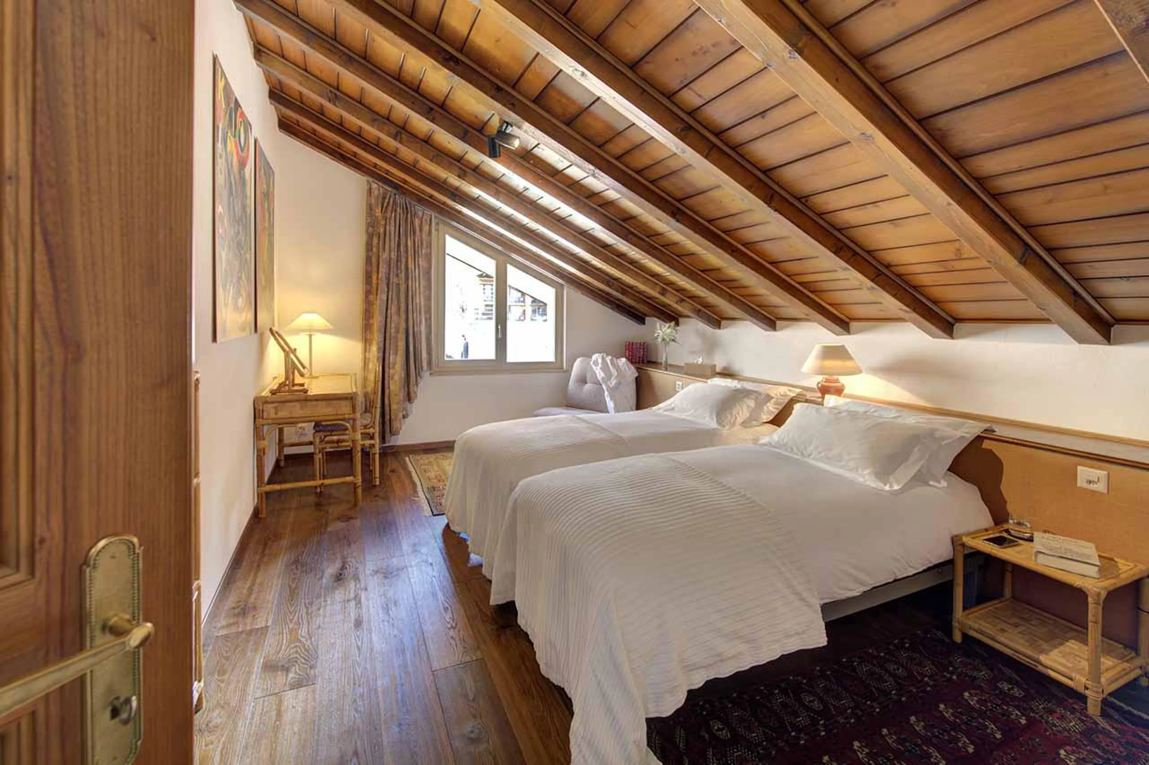 Double/twin bedroom with en-suite shower room at Penthouse Zen in Zermatt