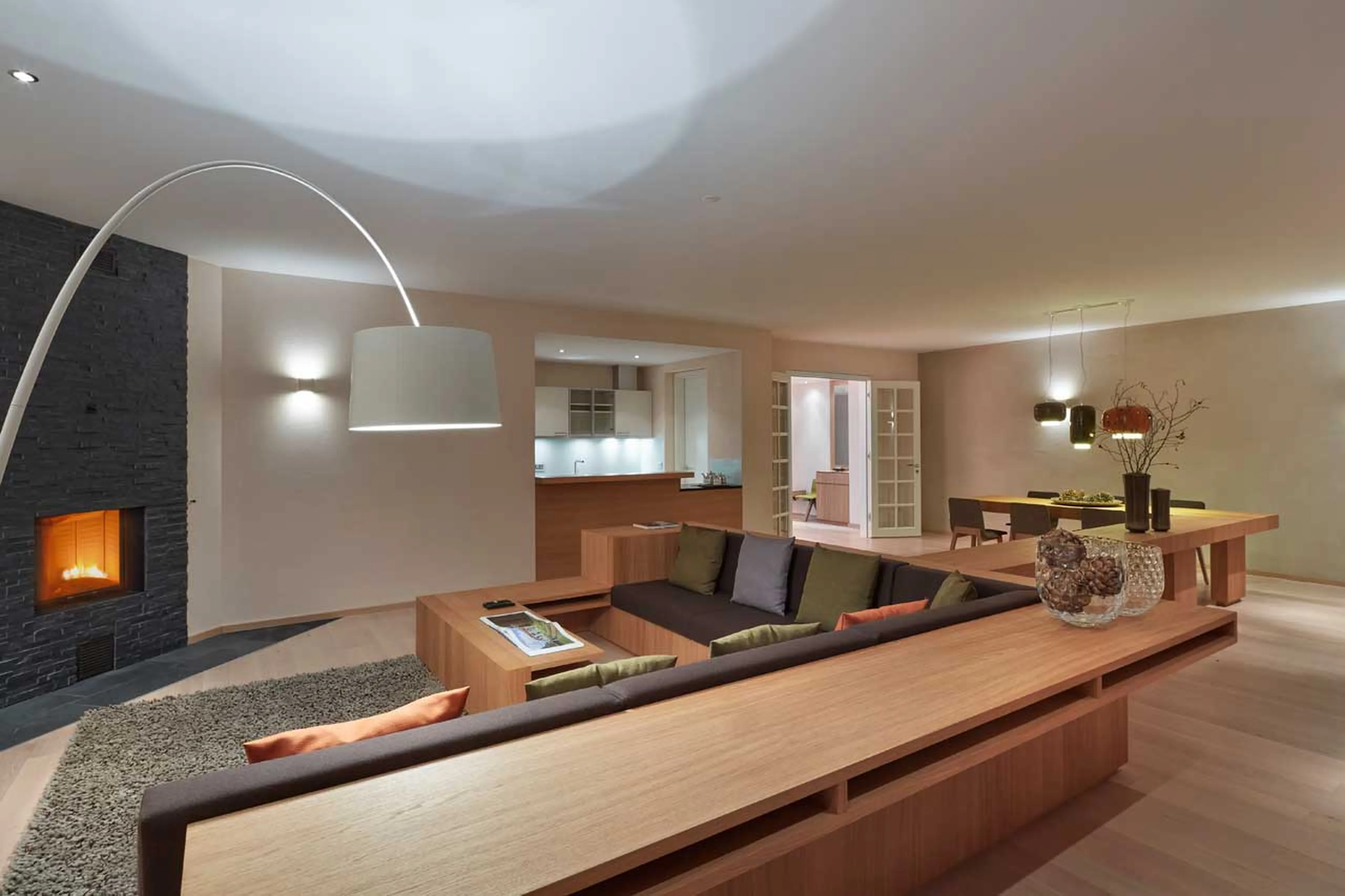 Living area with fireplace at Piz Gluna in St Moritz