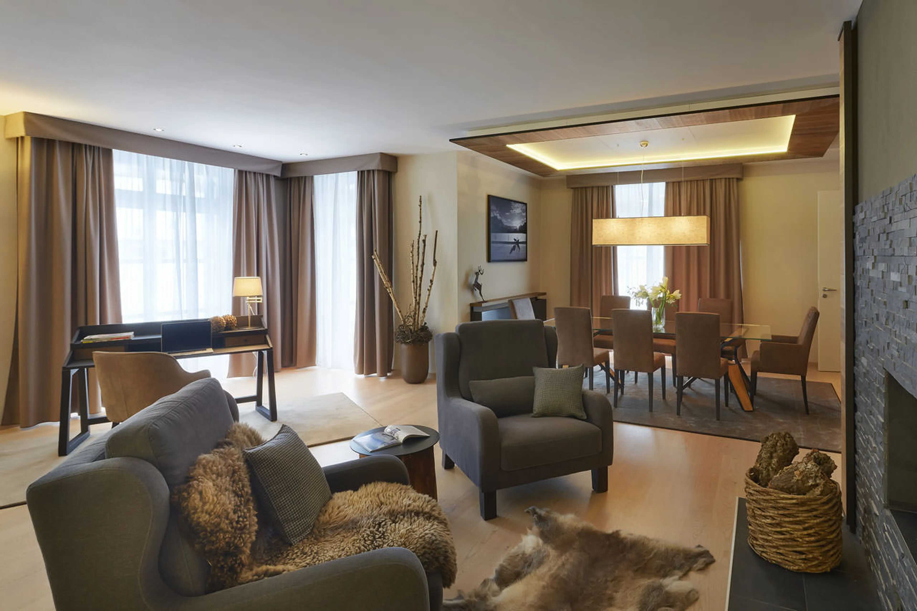 Armchairs in front of fireplace at Piz Vadret in St. Moritz