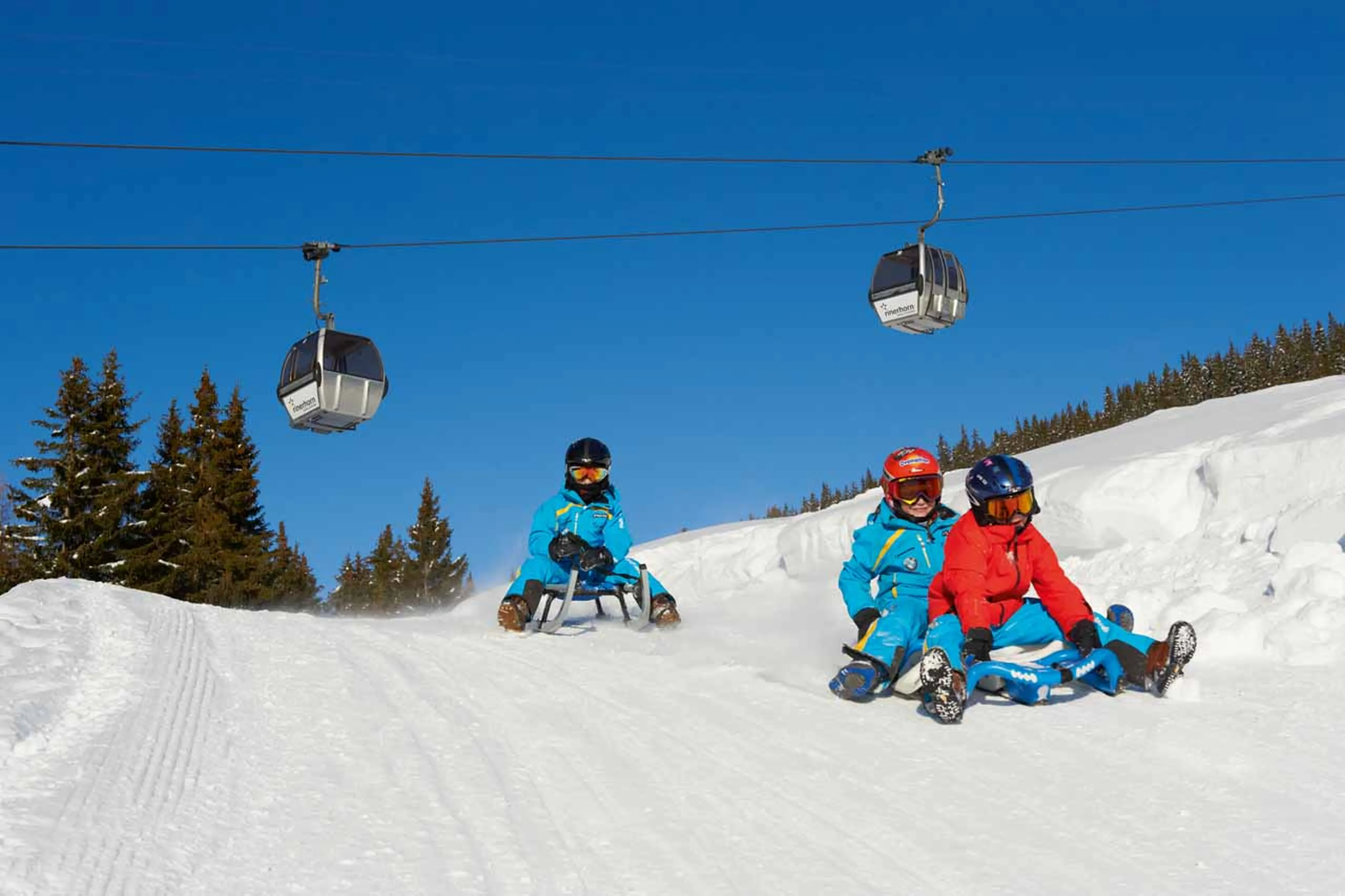 Tobogganing down the piste in Davos