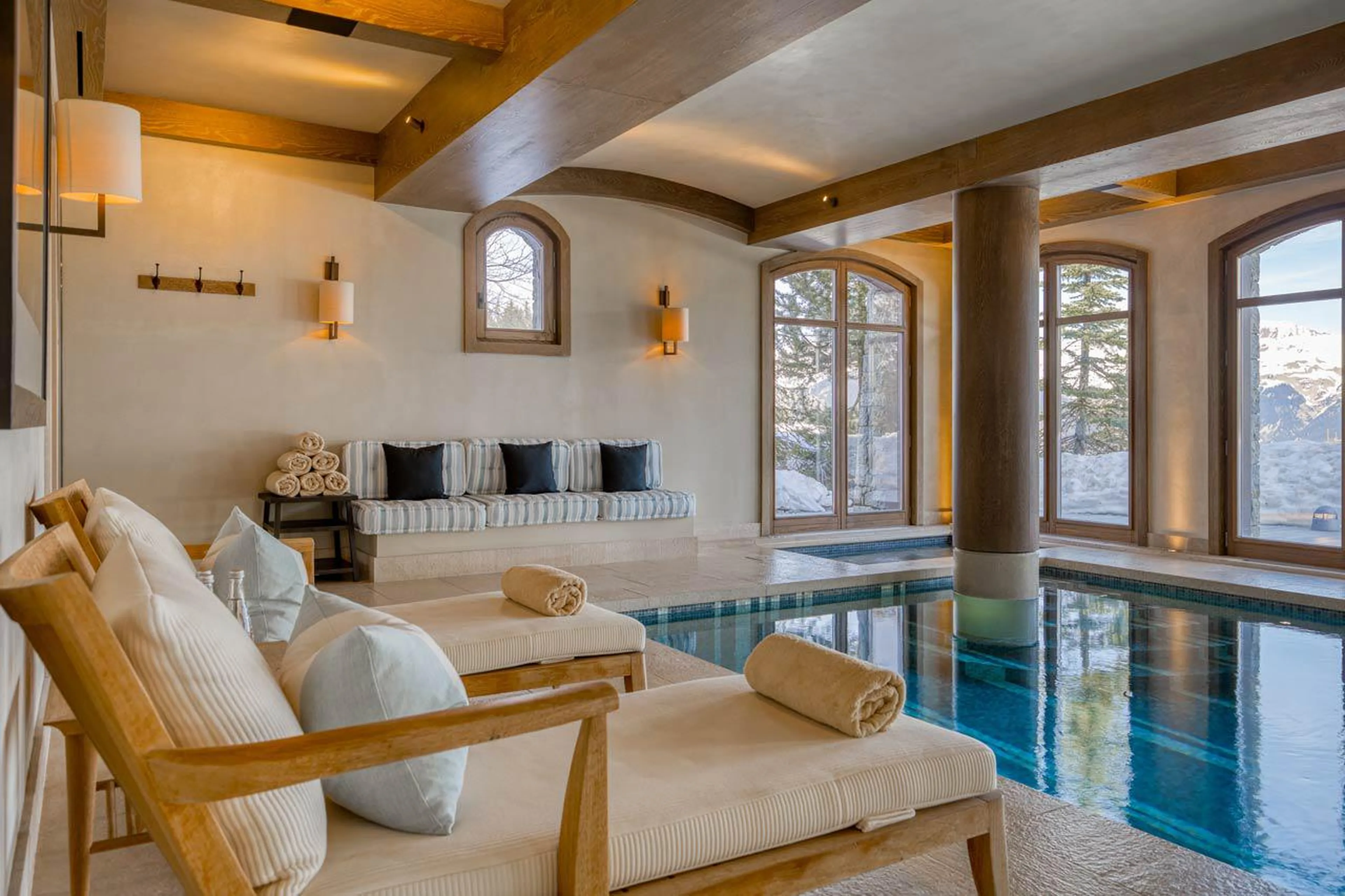 Loungers alongside pool in Shemshak Lodge in Courchevel 1850