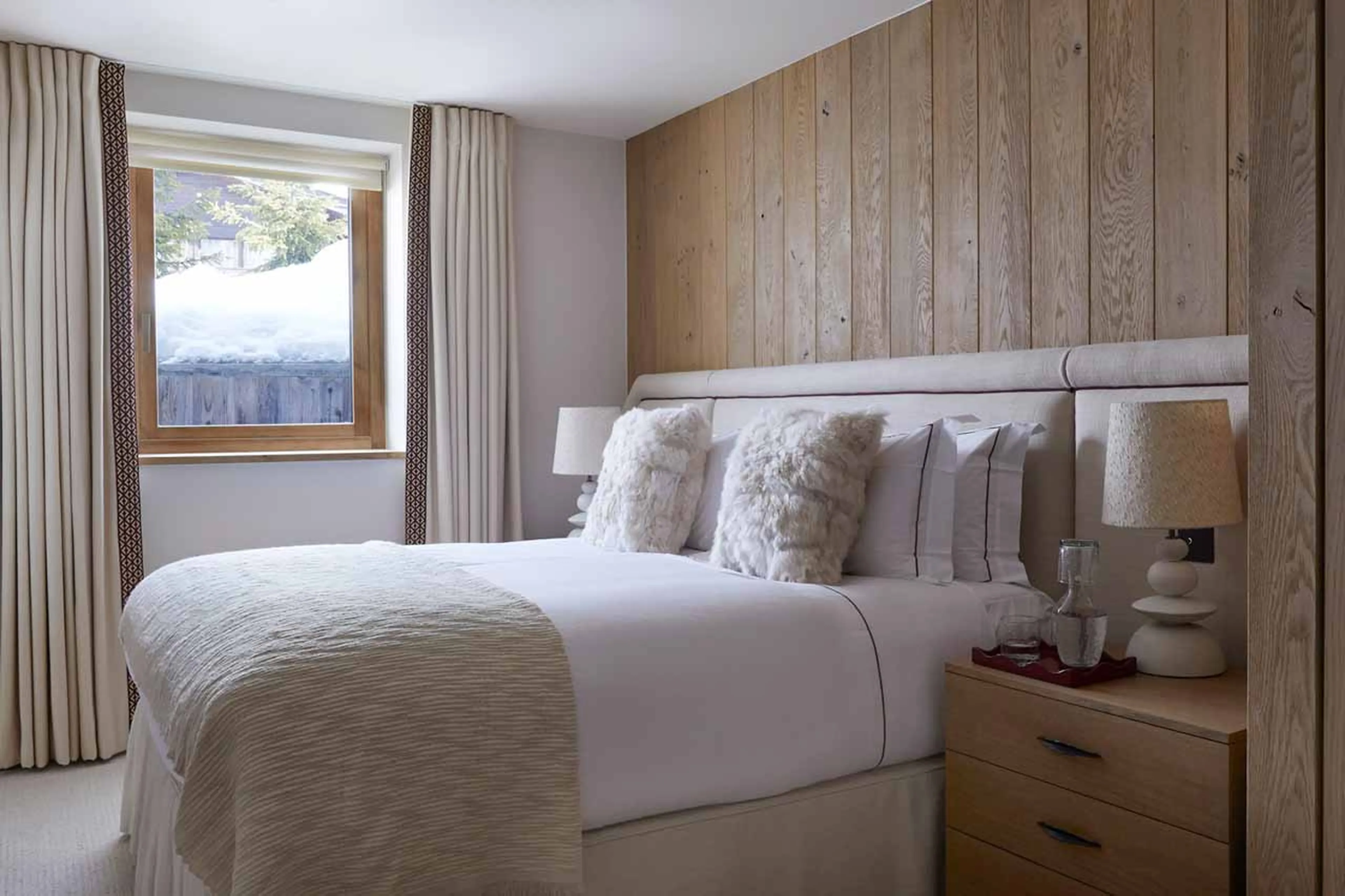Double bedroom with king-sized bed at Silverstone Lodge Penthouse 4 in Val d'Isere