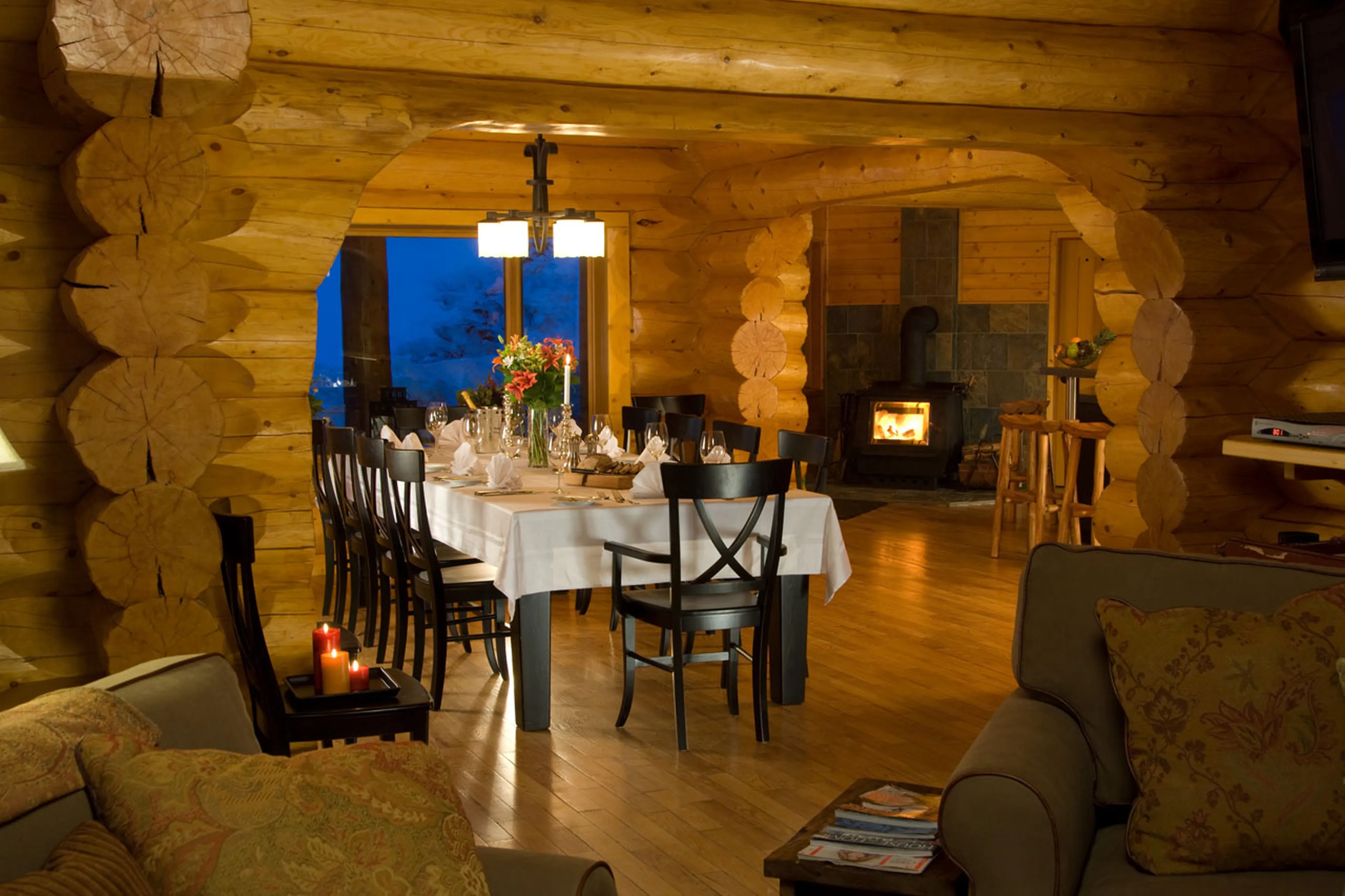 Dining area at night at Spirit Bear Lodge in South Chilcotin, British Columbia