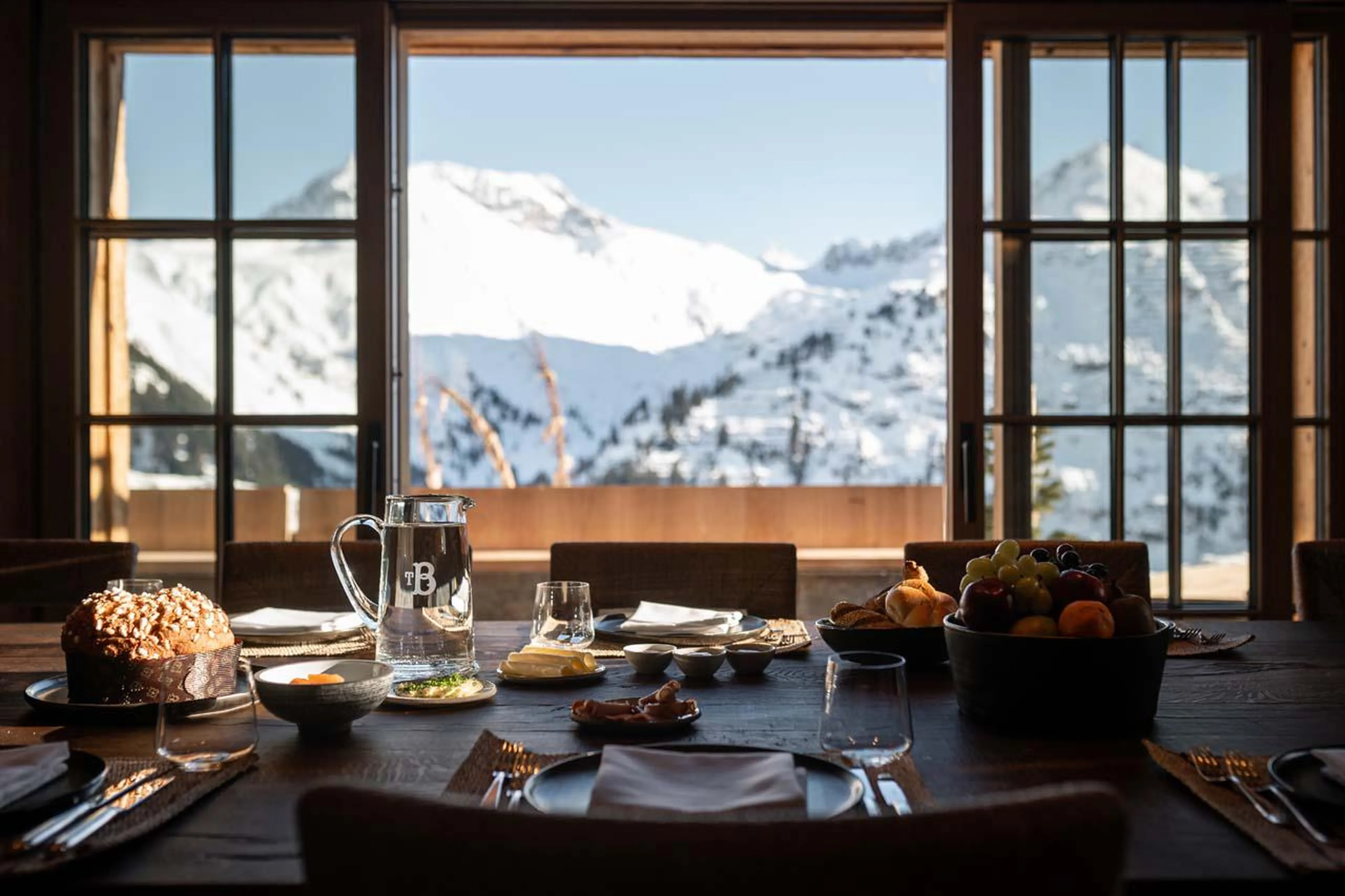 Dining table overlooking the mountain peaks at The Barn in Lech