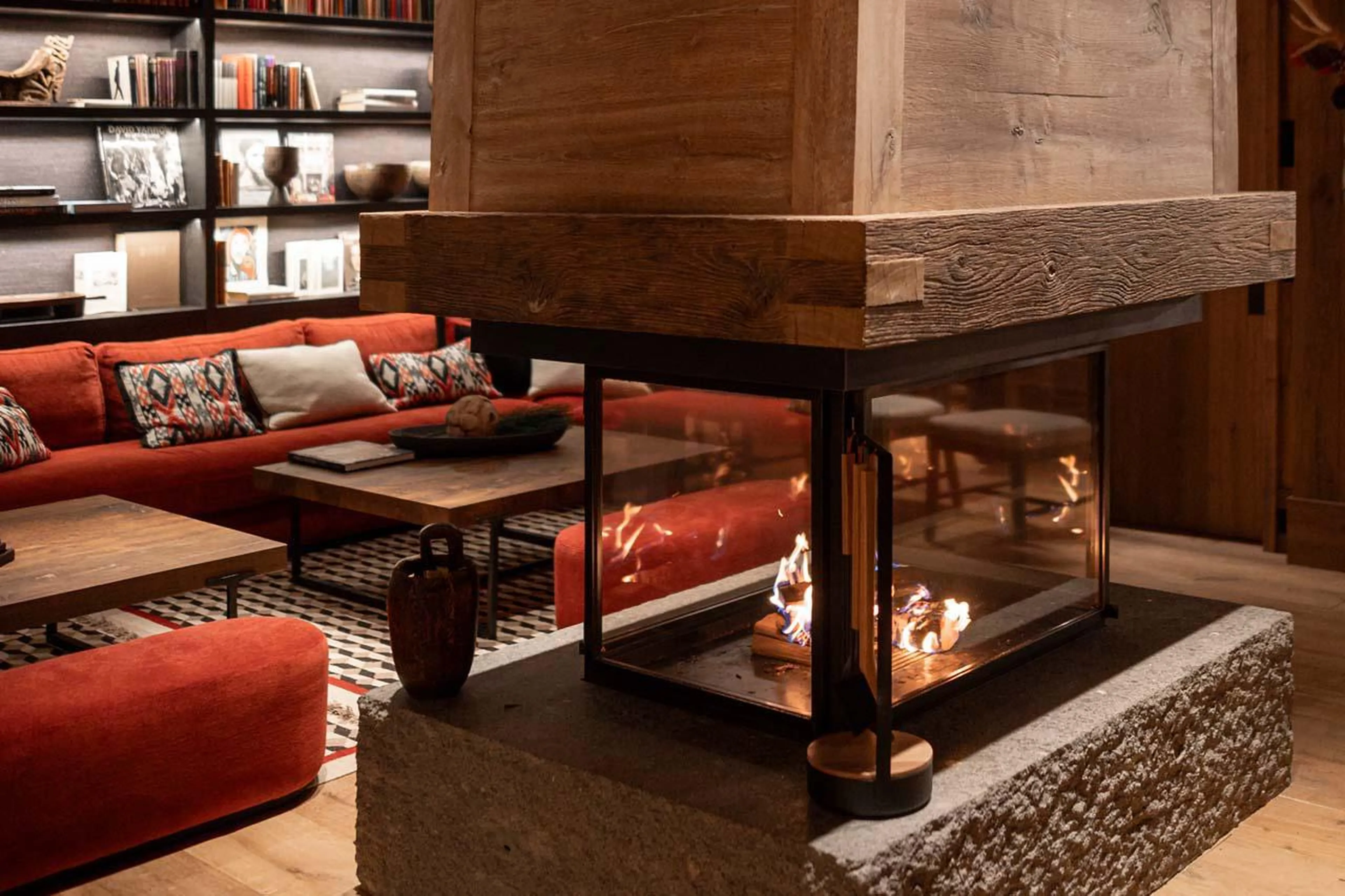 Open fireplace within the living area at The Barn in Lech