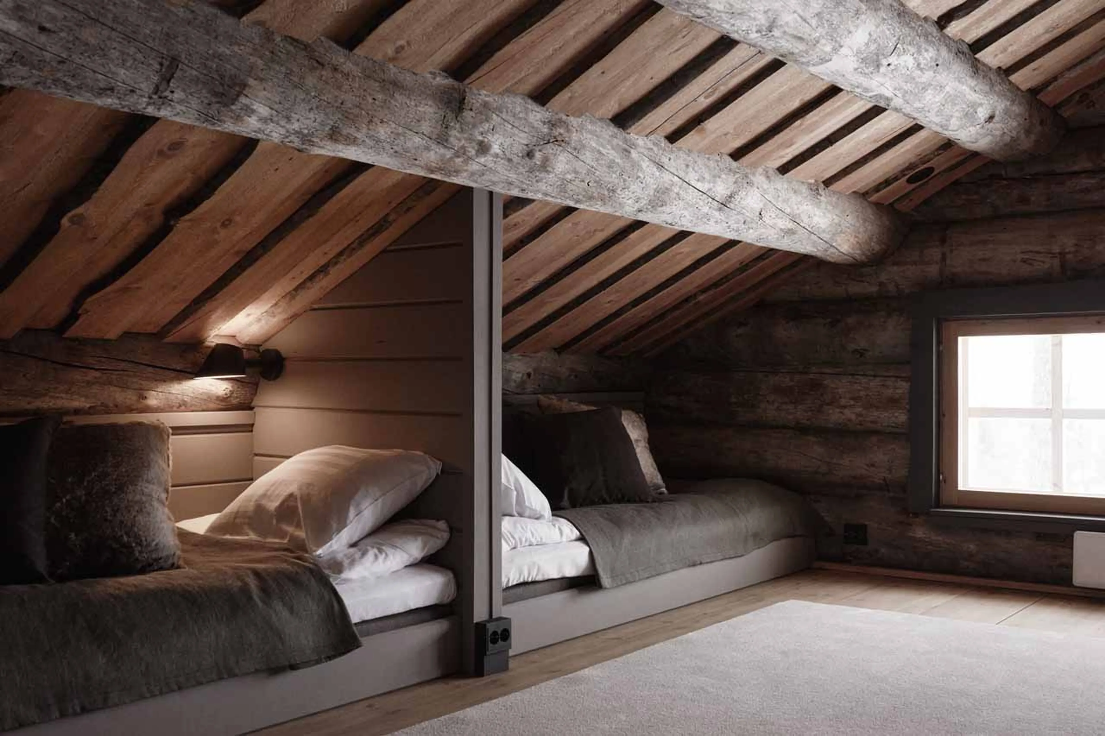 Loft beds under the eaves in The Fell Lodge, Finland