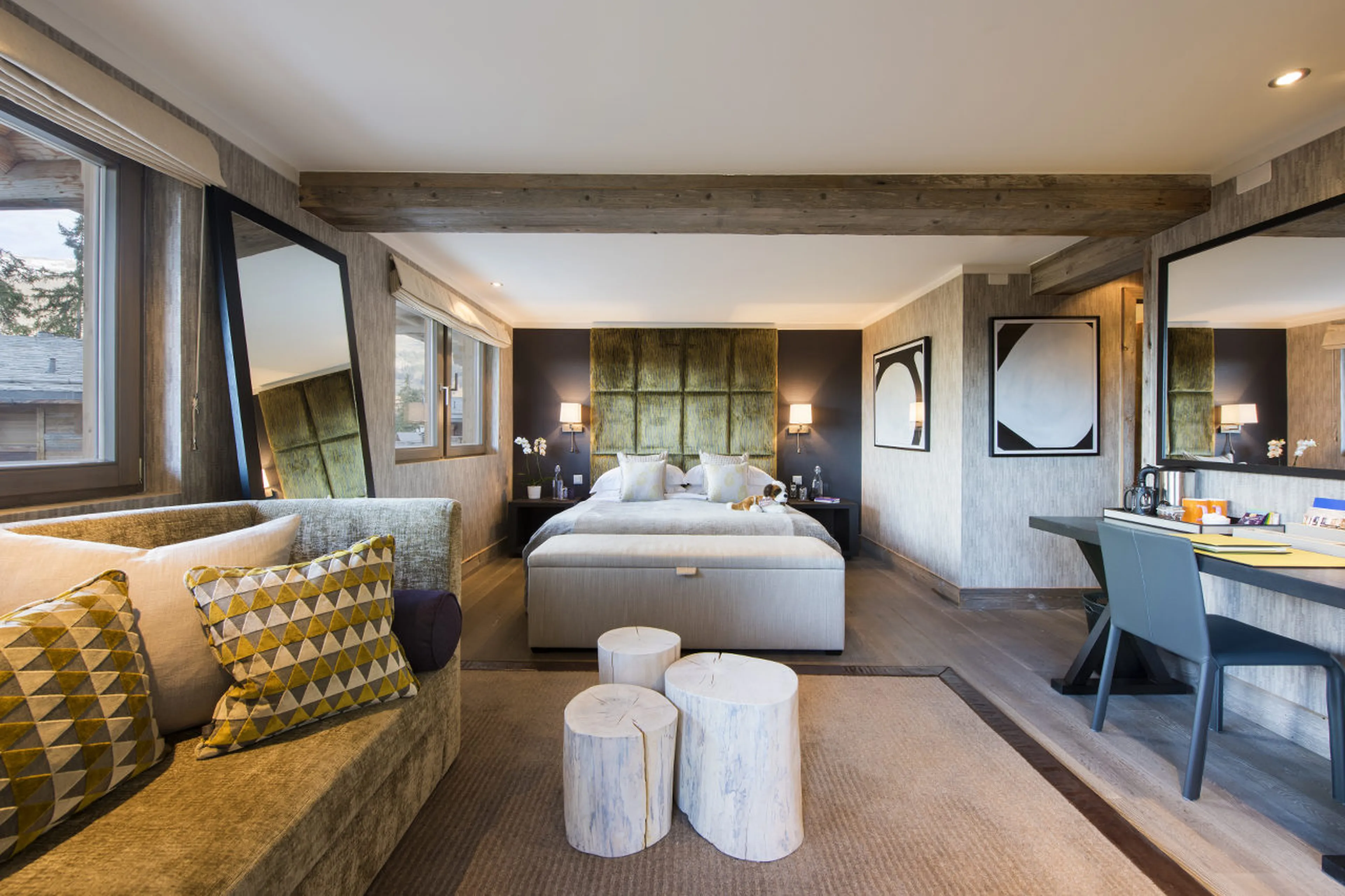 Sofas and desk in double bedroom in he Lodge in Verbier