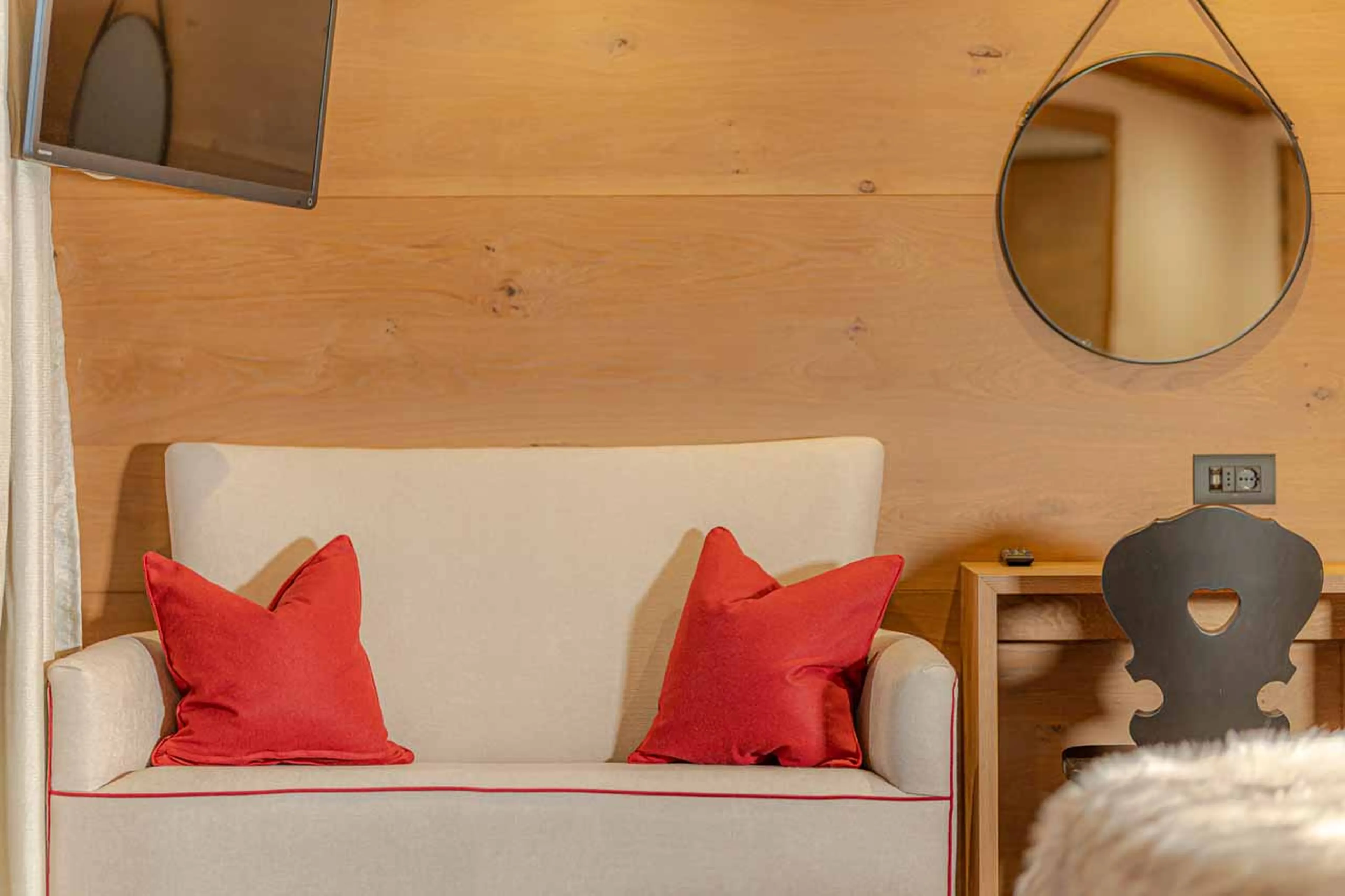 Sofa in bedroom at The Loft in Val Gardena