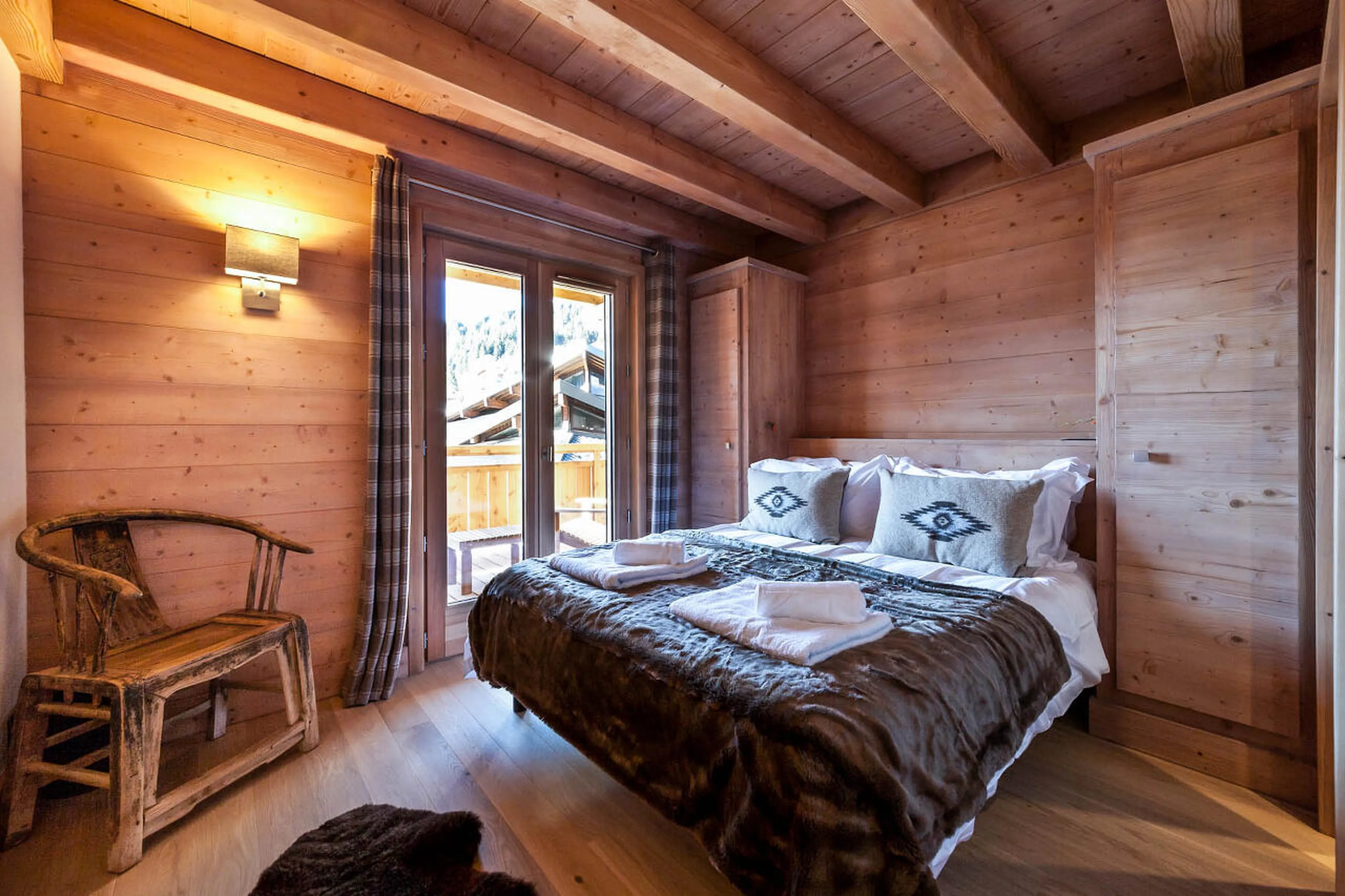 En-suite king-size bedroom with balcony access in The Penthouse, Les Gets