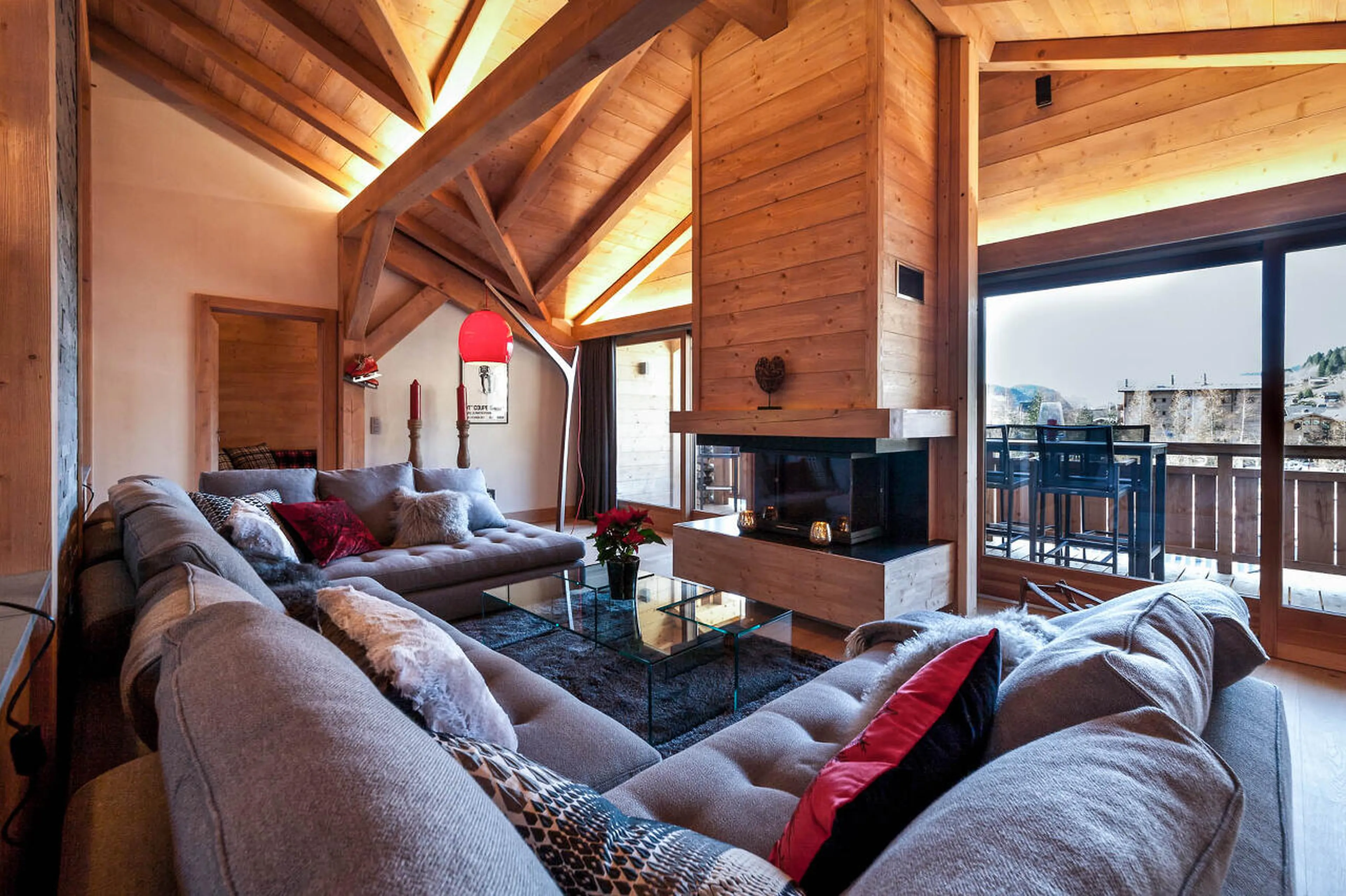 The Penthouse in Les Gets has an open plan living area with balcony access