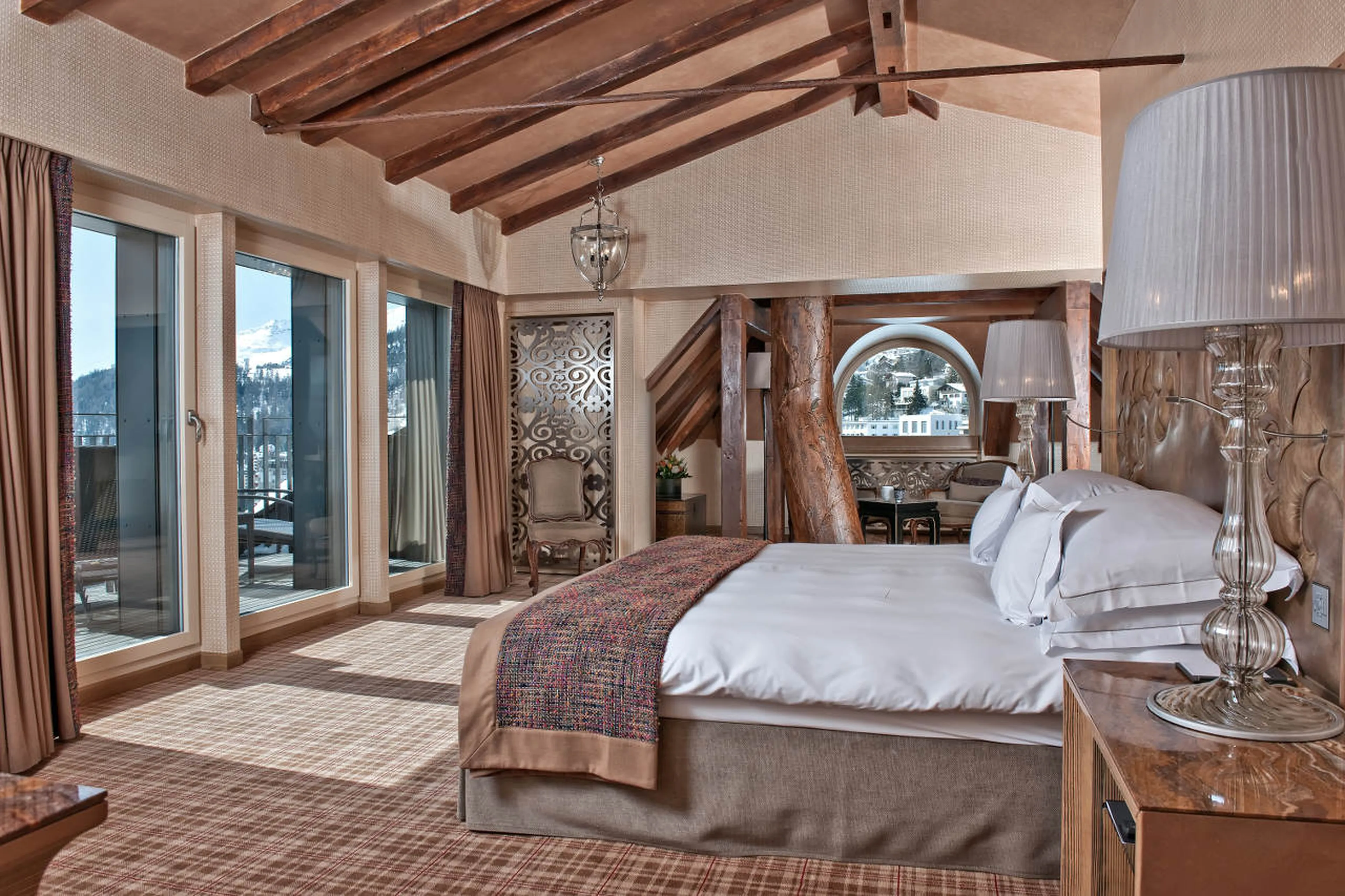 King-size bed of master bedroom in The Penthouse in St Moritz