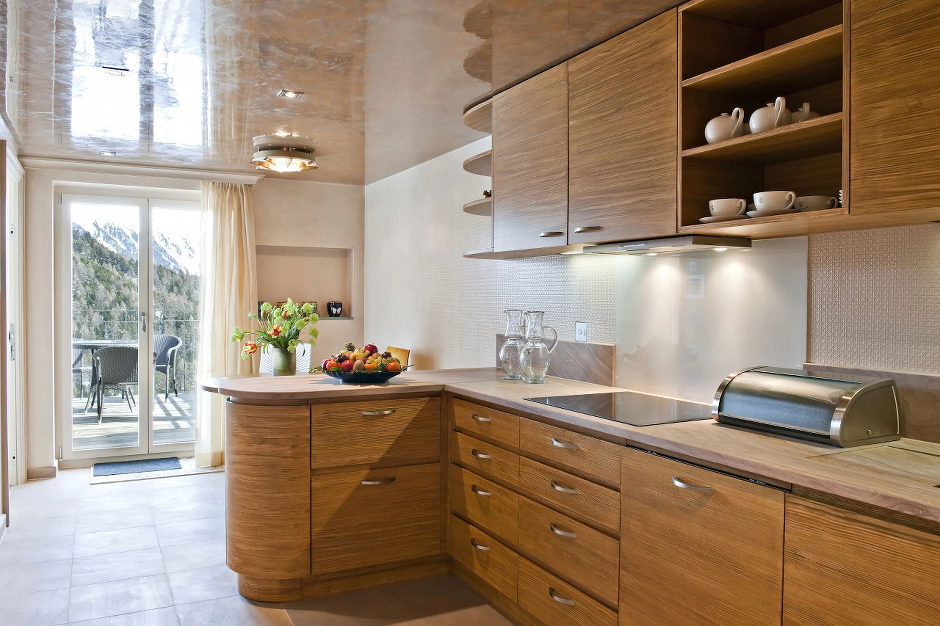 Kitchen leading to balcony of The Penthouse in St Moritz