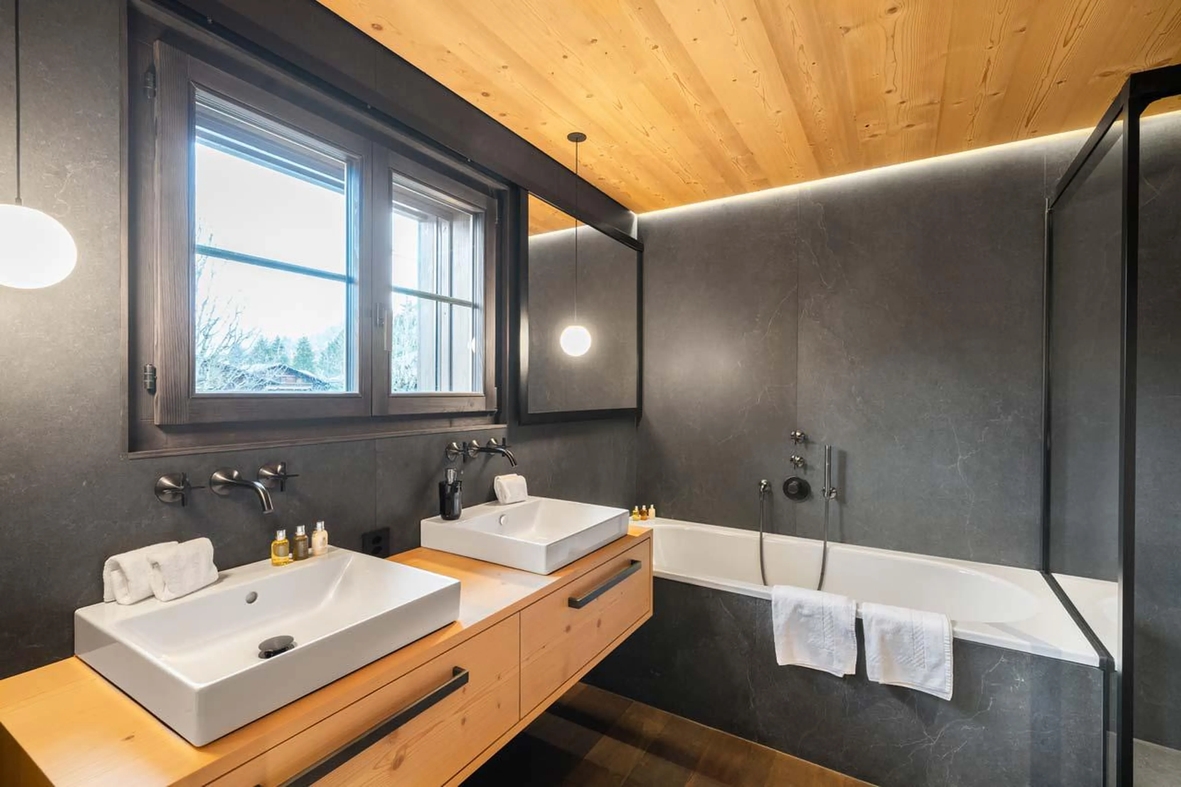 Modern and stylish en-suite bathroom at Apartment Eggli in Gstaad