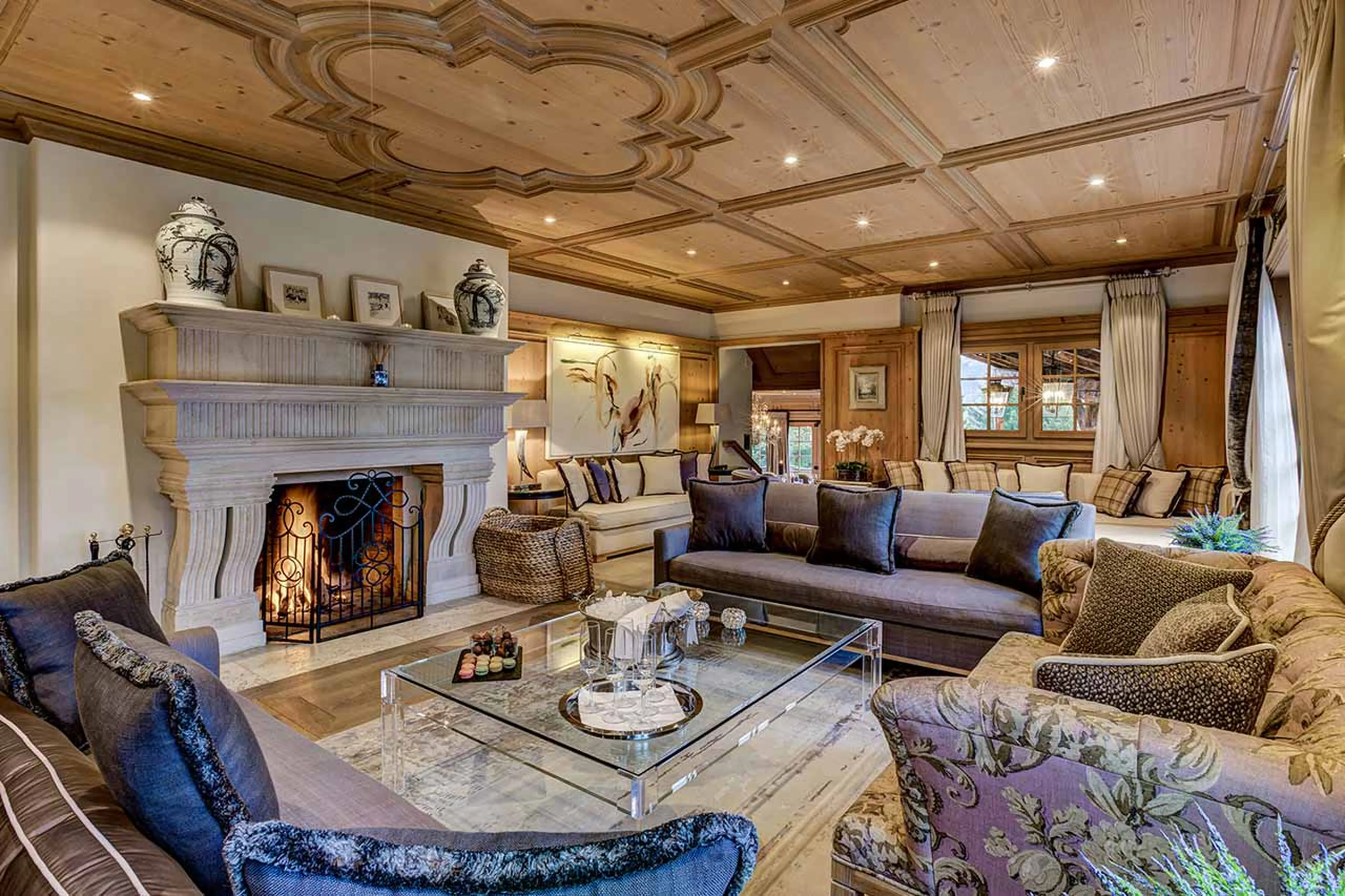 Drawing room with fireplace at  Tivoli Lodge in Davos