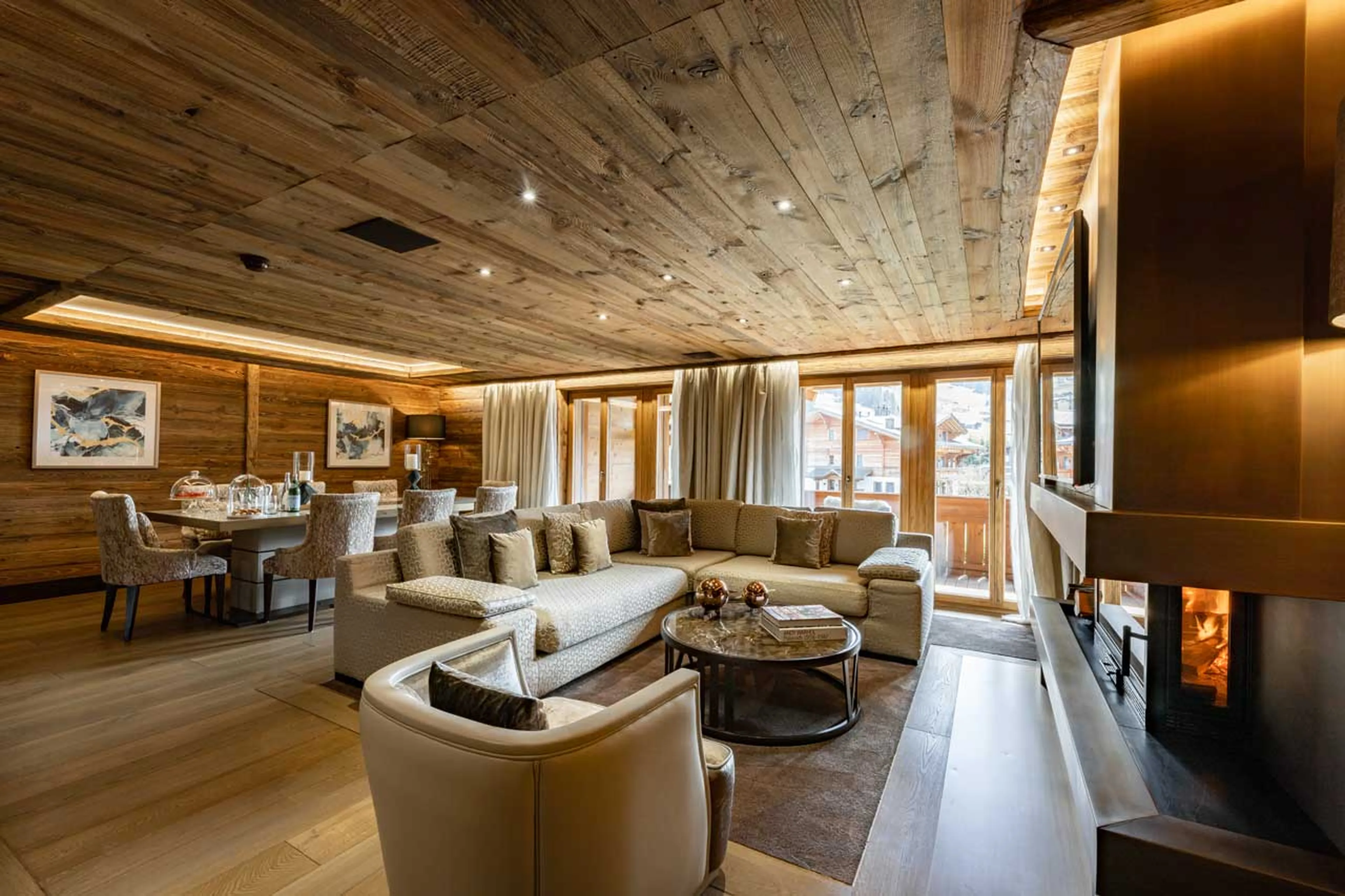 Living area with fireplace at Ultima Gstaad 4BR Residence in Gstaad