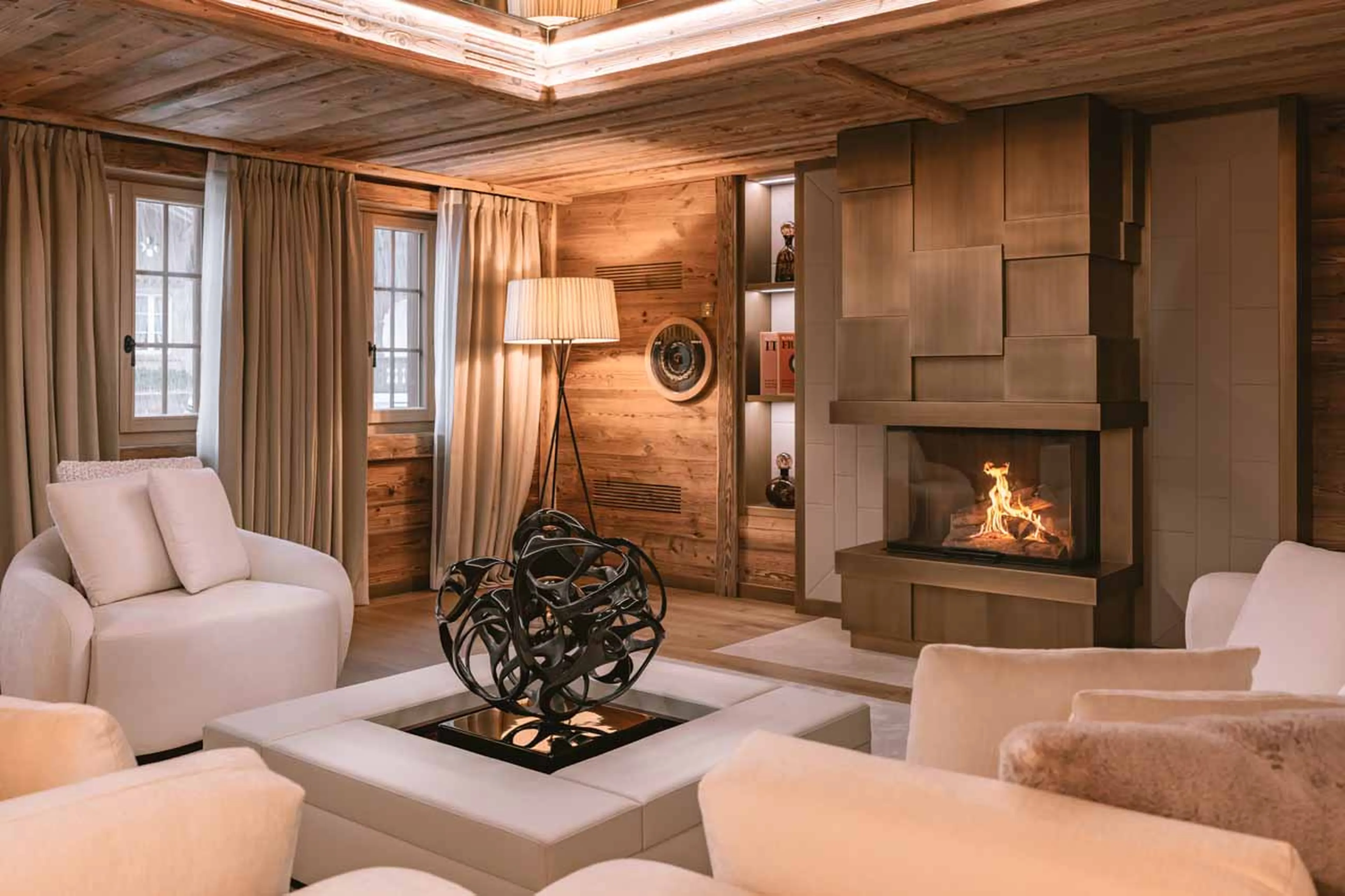 Living area fireplace in Ultima Gstaad Promenade in Gstaad