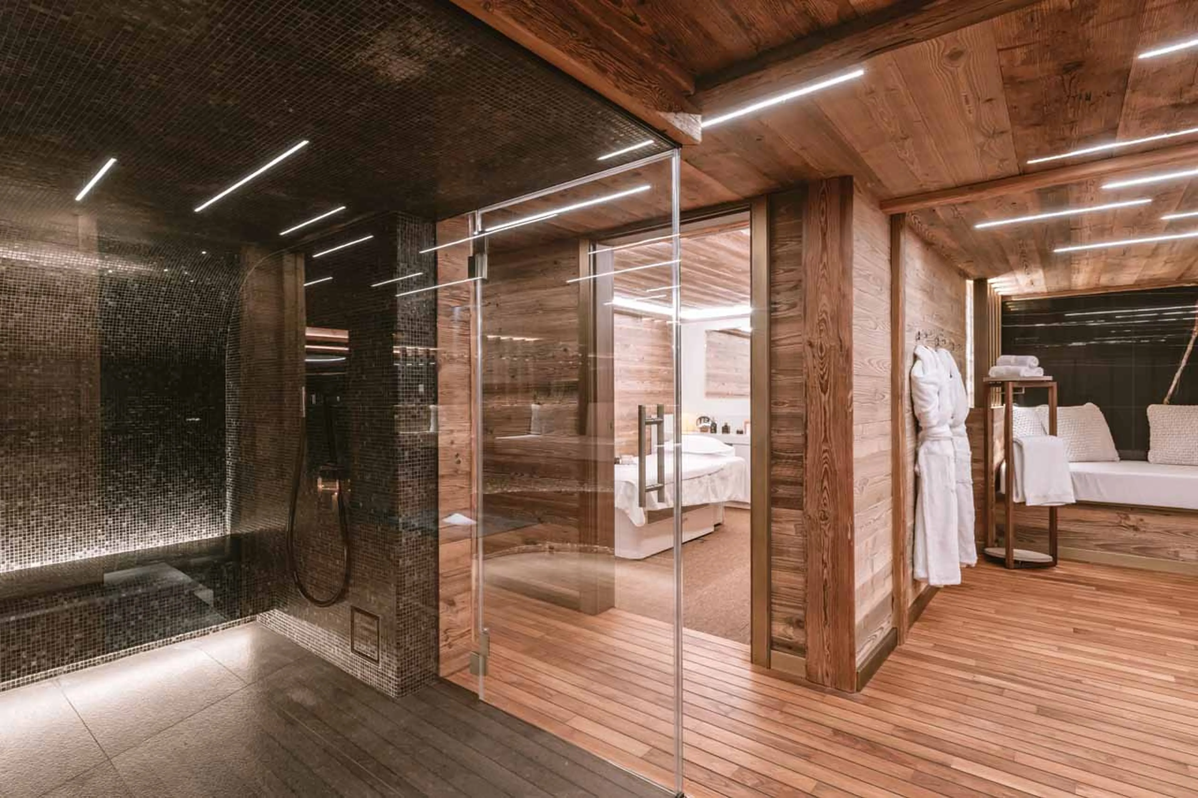 Wellness area with snow shower, seating and pool in Ultima Gstaad Promenade, Gstaad