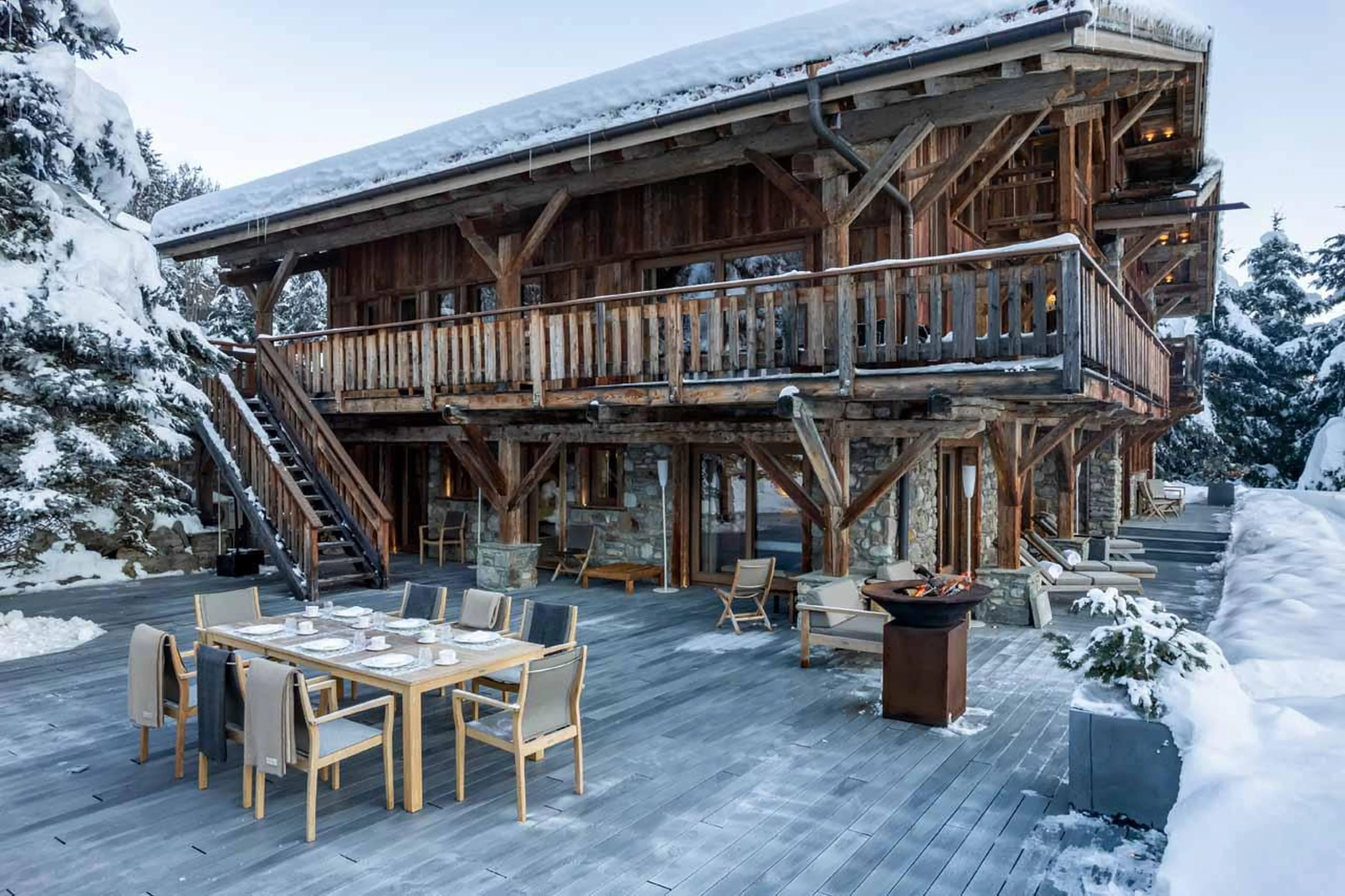 Chalet exterior featuring outdoor dining space at Ultima Megeve