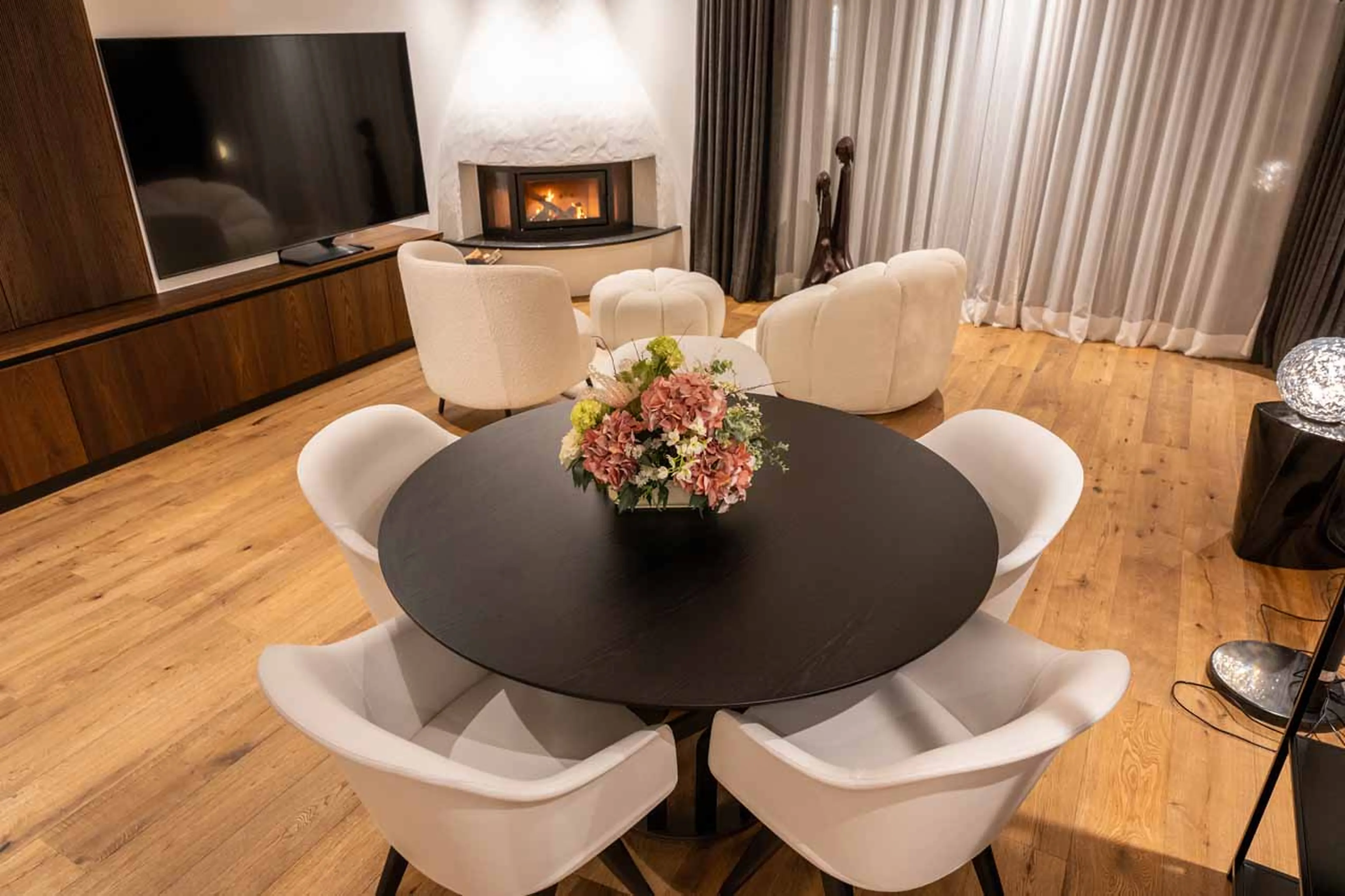 Table and fireplace at Chalet Carolina in Val Gardena