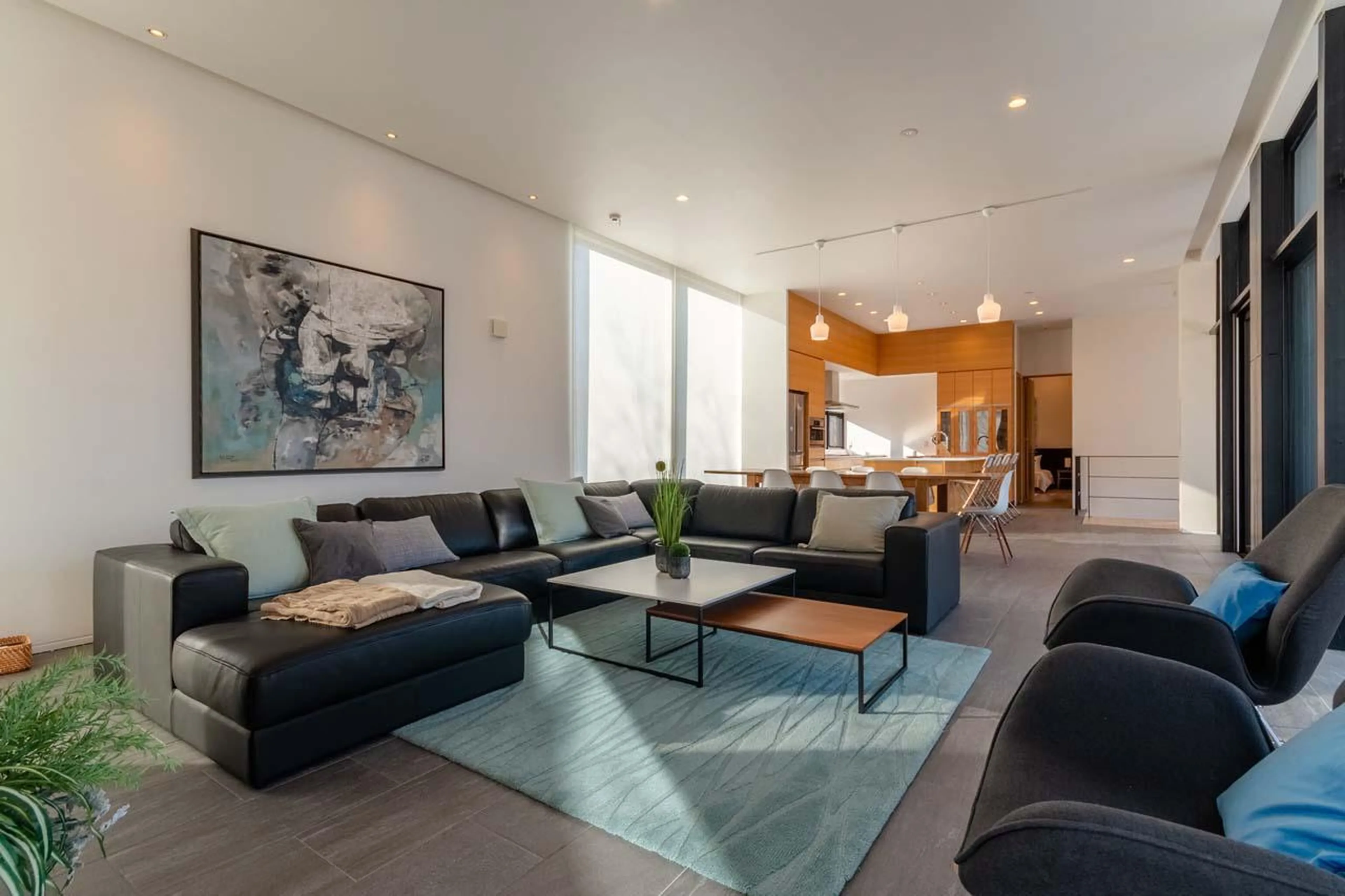 Open-plan living area with large sofas at Yanagi House in Niseko