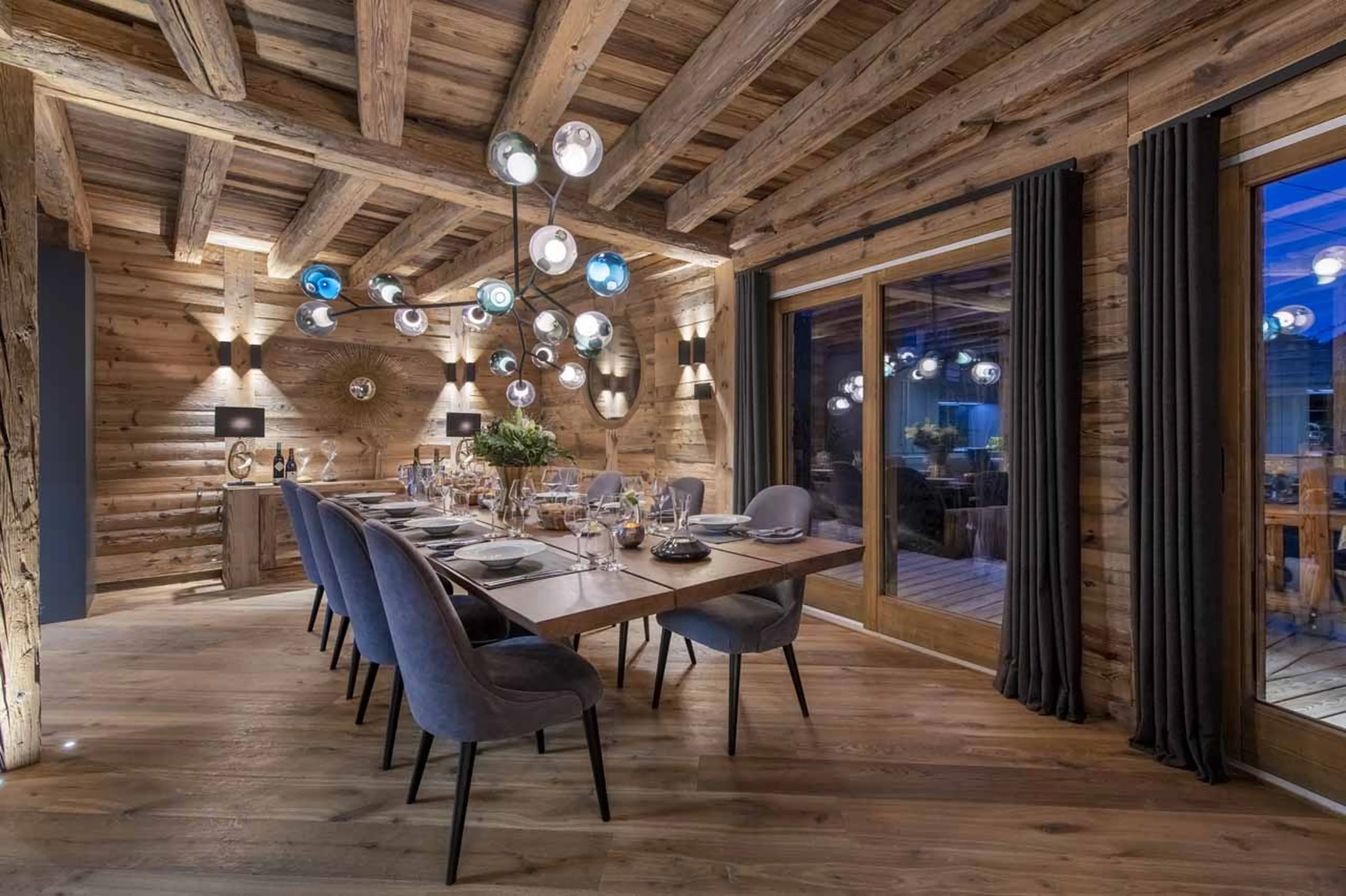 Dining area at night at ZEMS Lodge in Morzine